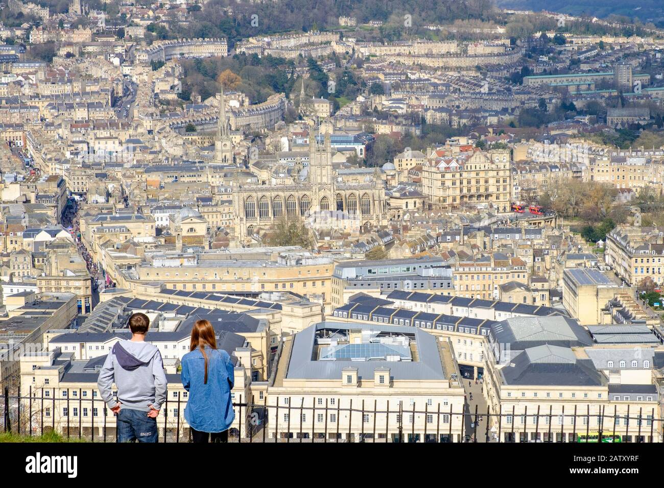 People taking advantage of the high vantage point view are pictured in Alexandra Park looking down at the city of Bath. Bath Somerset England uk Stock Photo