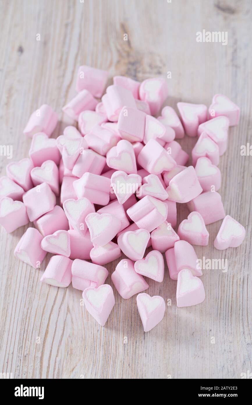 Pink heart shaped marshmallows on white background Stock Photo - Alamy