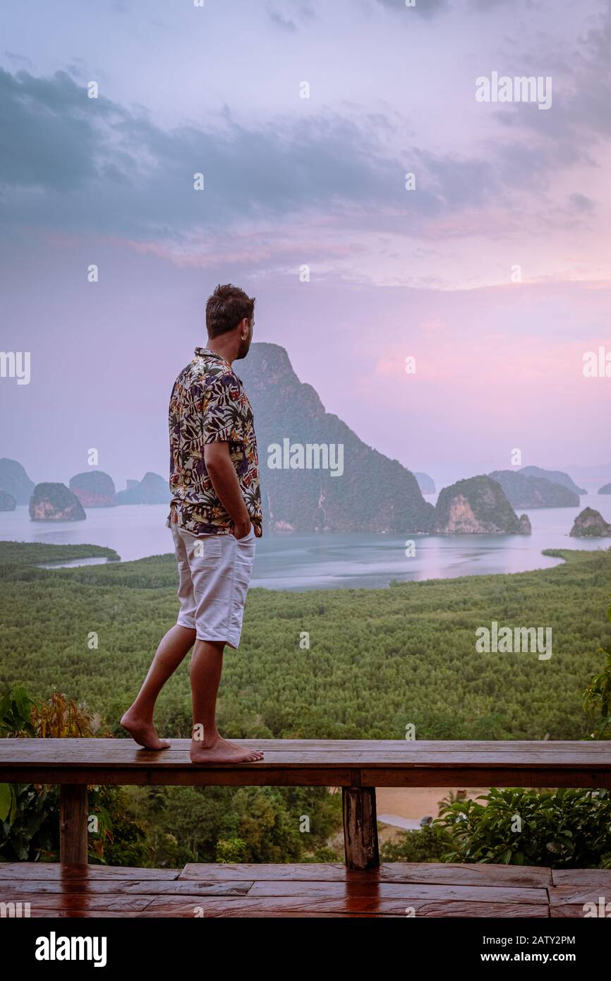 Phangnga Bay Thailand , Samet Nang She viewpoint over the bay, men vacation Thailand watching sunsrise Stock Photo