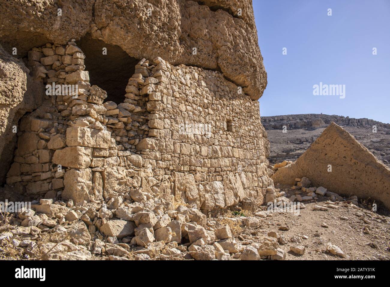 abandoned very old stone buildings in the Tafila area of ​​Jordan Stock Photo