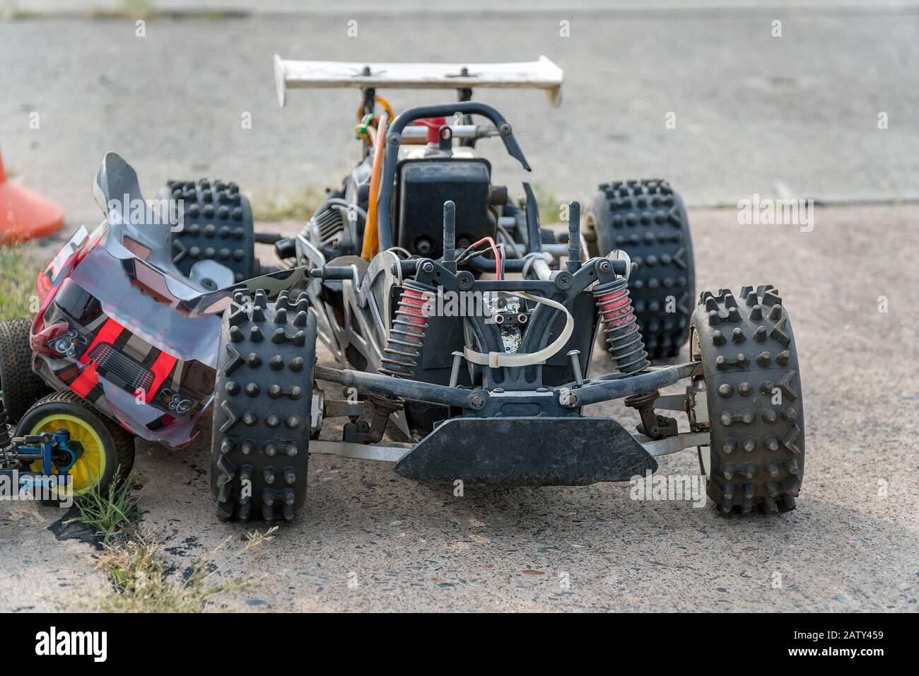 Disassembled RC model racing cars. Model cars without top. Radio