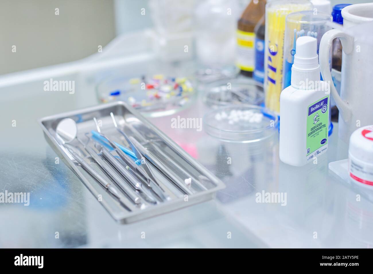 Kyiv UA, 31-07-2019. Close-up of working desk in dentist office with dental composite sealing materials resins, various professional dental instrument Stock Photo