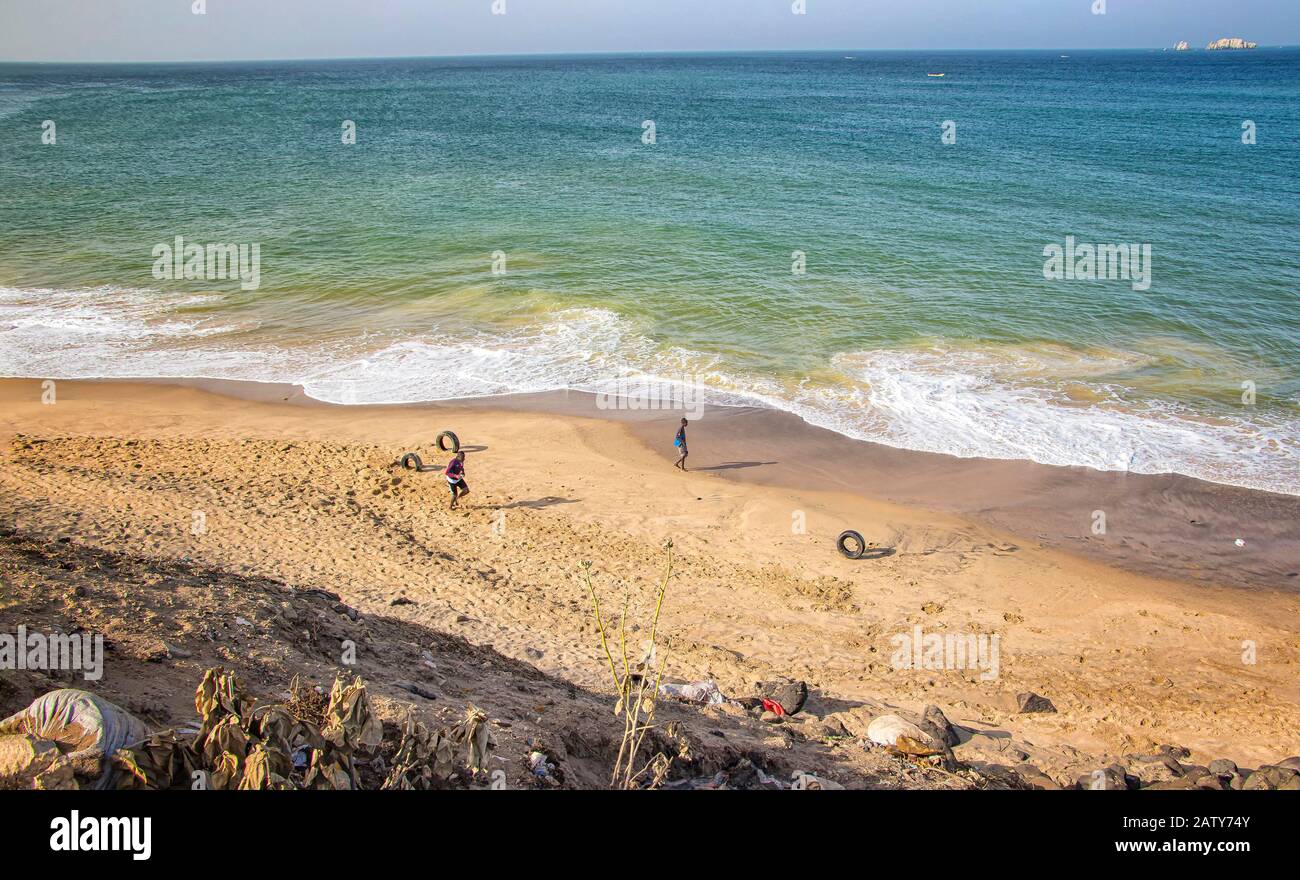 Dakar, Senegal- April 24 2019: Men playing football on the beach near Dakar city in Africa. Stock Photo