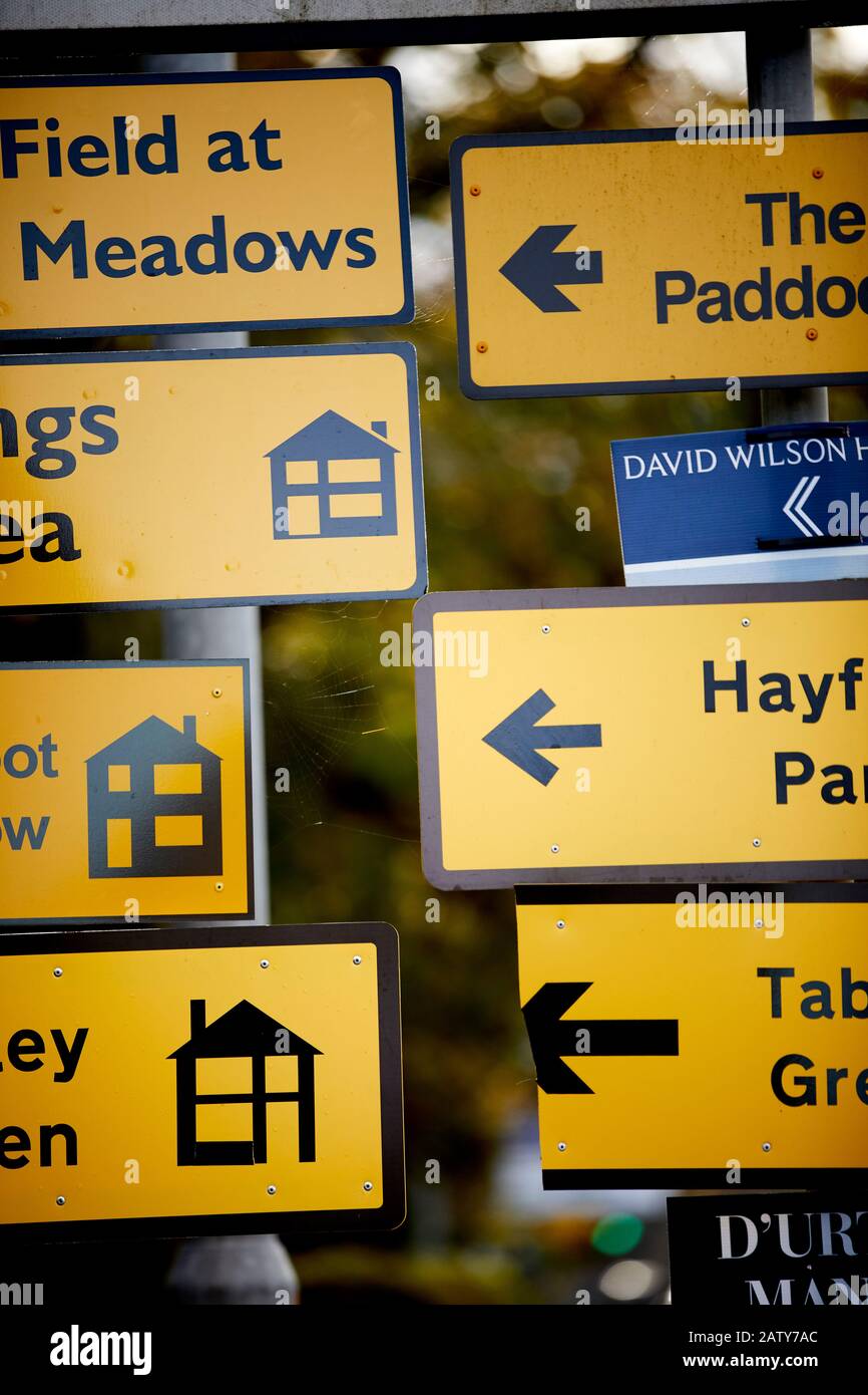 Lancashire yellow signs pointing to new houses development sites and show homes Stock Photo