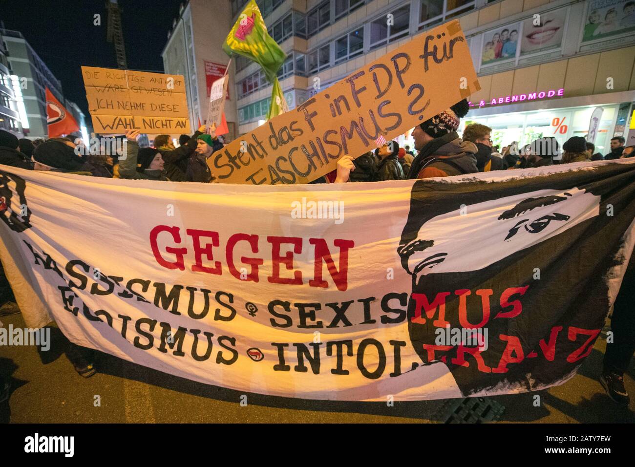 Munich, Germany. 05th Feb, 2020. Demonstrators stand with posters and banners with the inscription 'Against sexism - racism - egoism - intolerance' and 'Does the F in FDP stand for fascism' in front of the FDP office in Munich. Hundreds of people have protested against the election of FDP politician Kemmerich as Thuringian Minister President with votes from the AfD. Credit: Lino Mirgeler/dpa/Alamy Live News Stock Photo