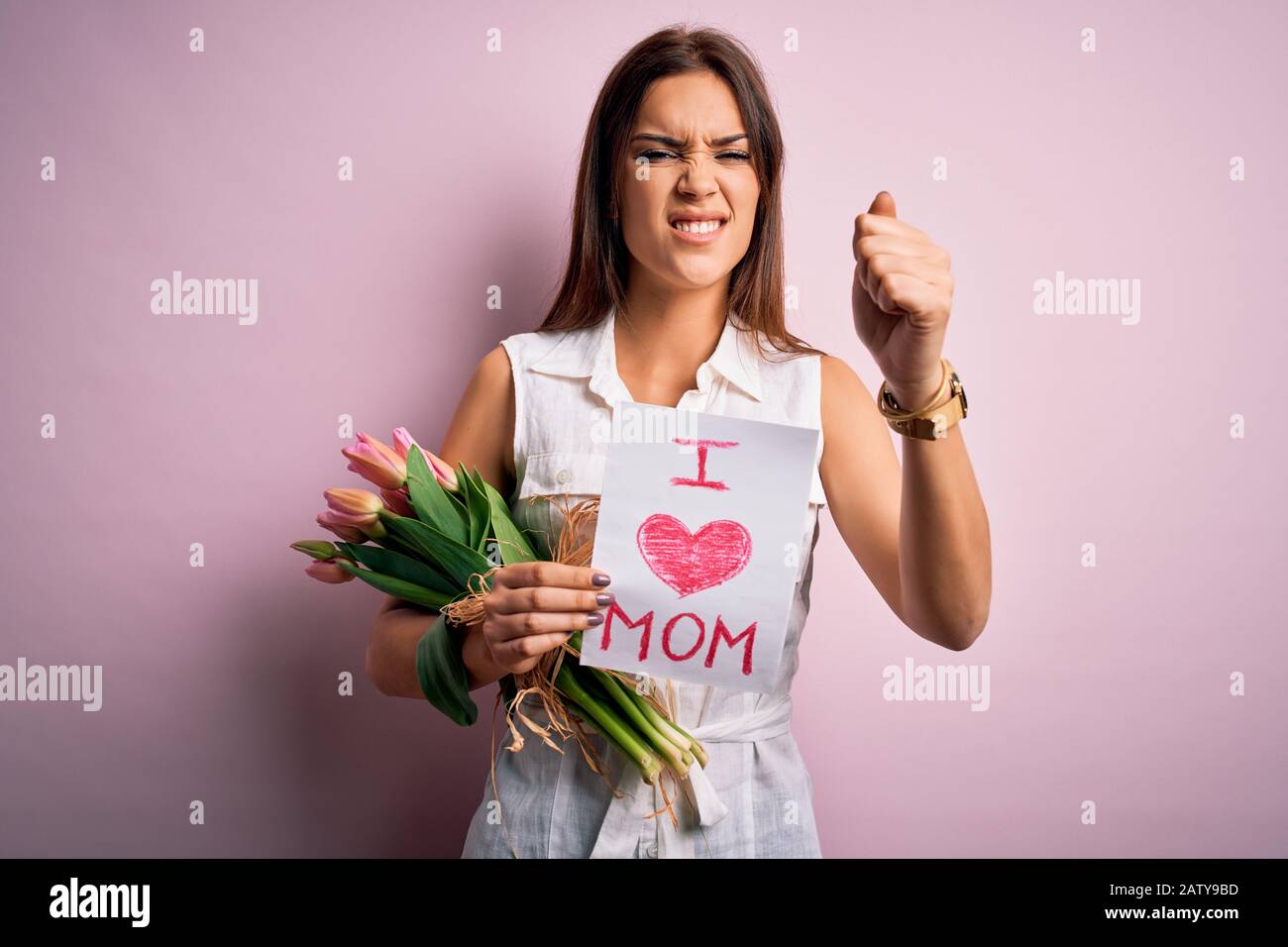 Beautiful woman celebrating mothers day holding love mom message and ...