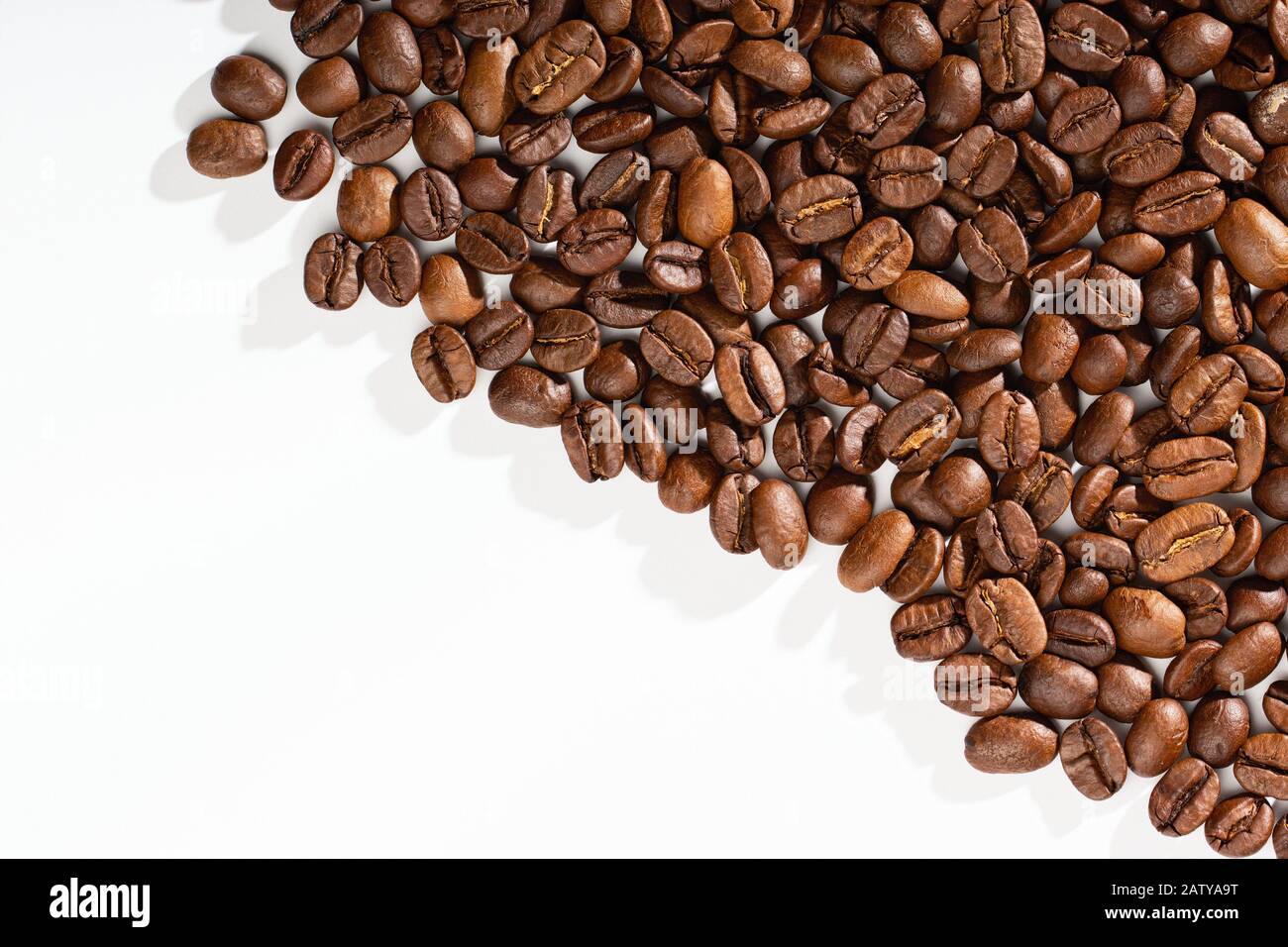 Coffee beans on a white background with place for text Stock Photo - Alamy