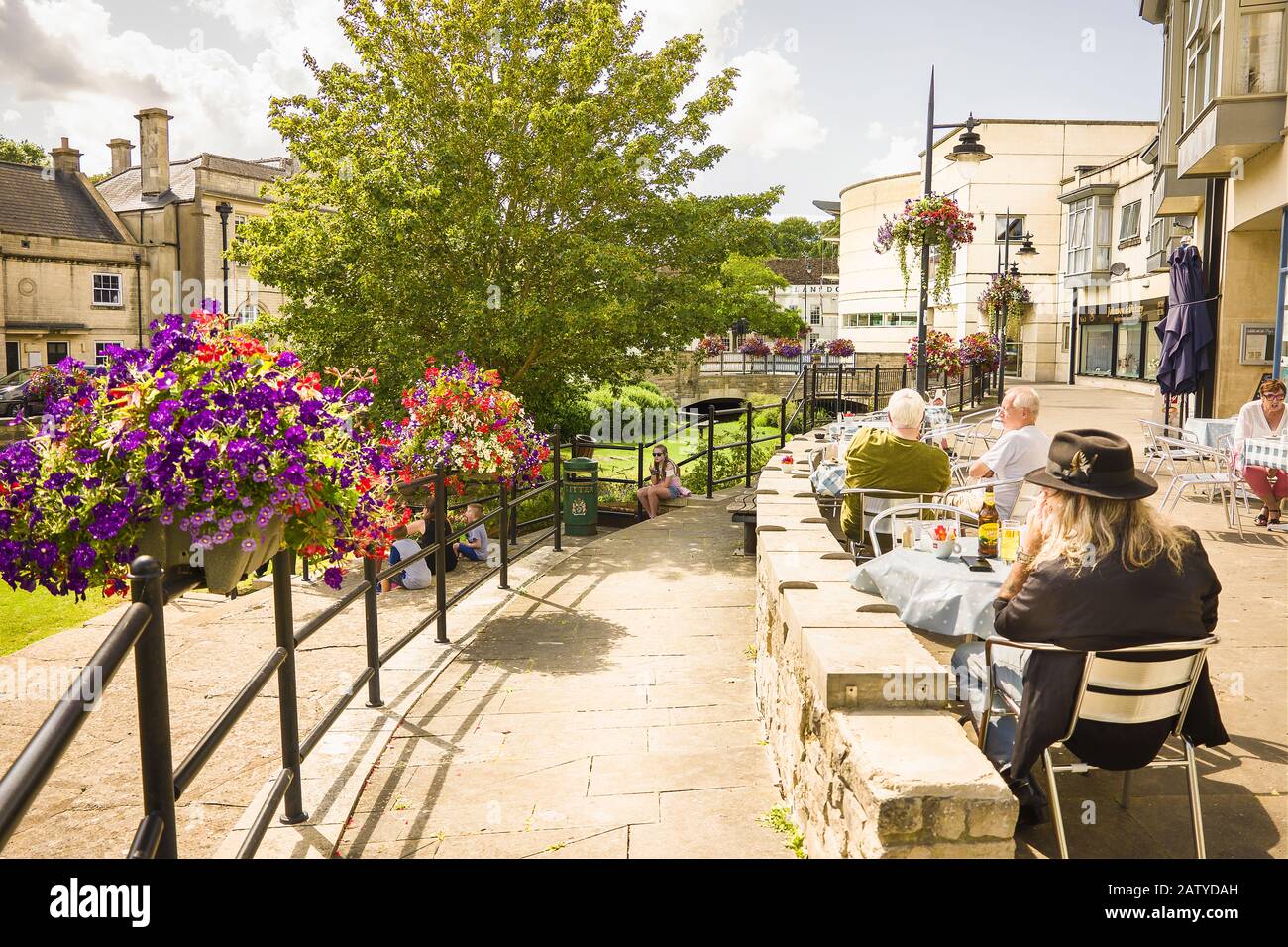 Open air eating and drinking on a sunlit terrace in the heart of Calne in Wiltshire England UK Stock Photo