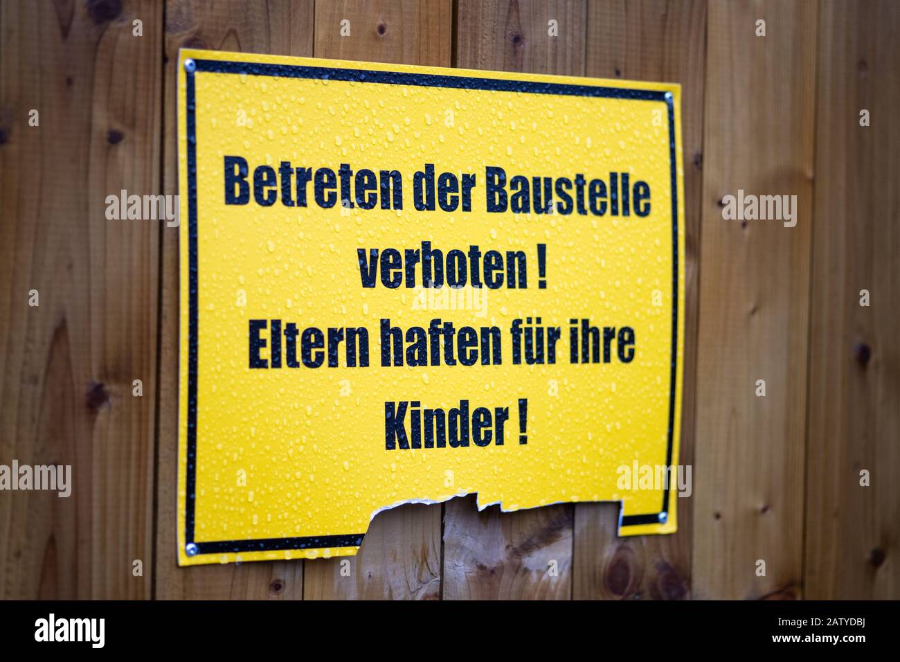 Liability, no trespassing Sign on a German construction site: Parents are accountable for their children Stock Photo