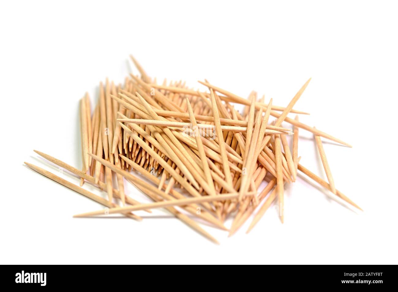 Wooden toothpicks against white background Stock Photo - Alamy