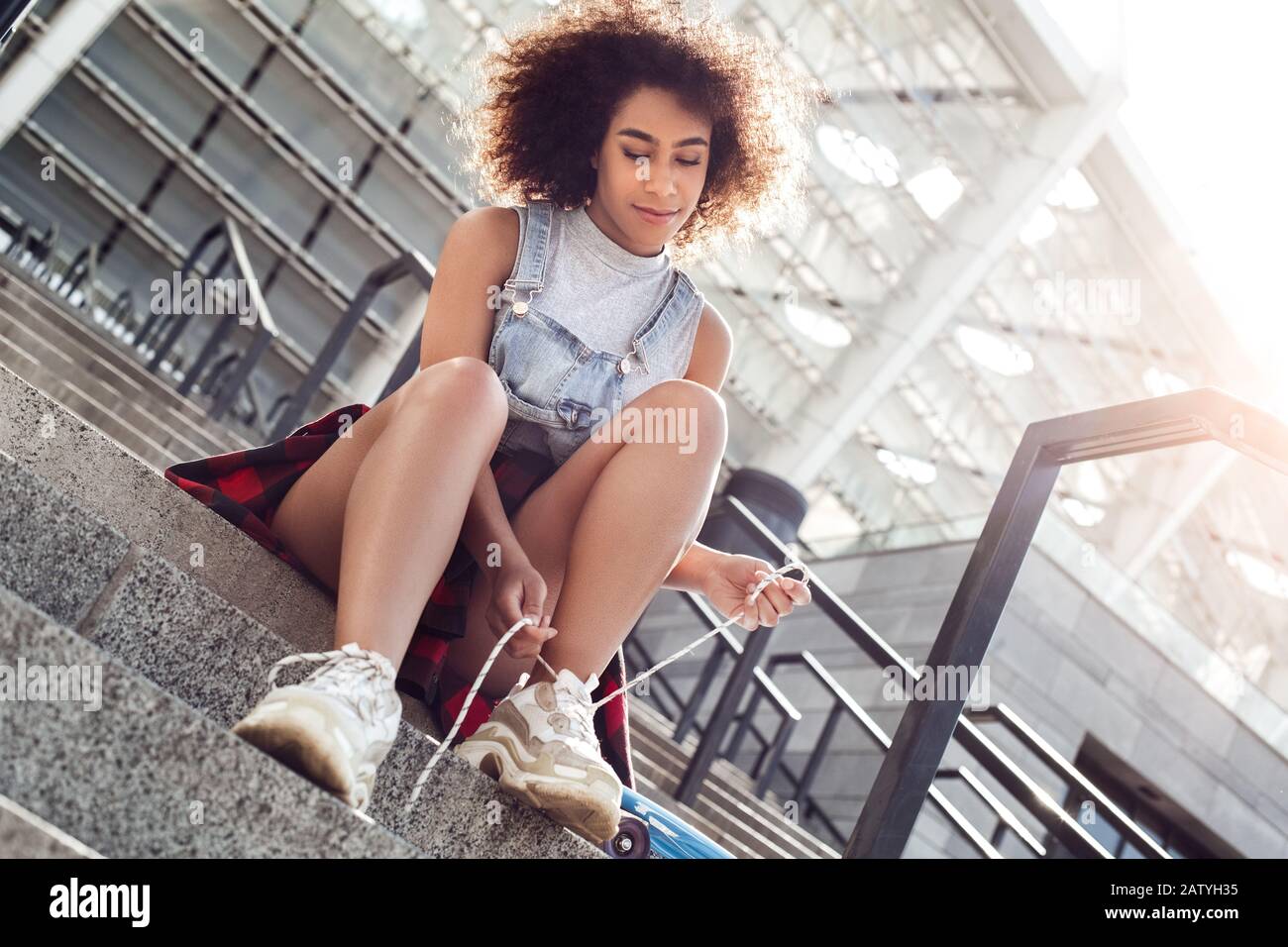African woman side view sitting hi-res stock photography and images - Alamy