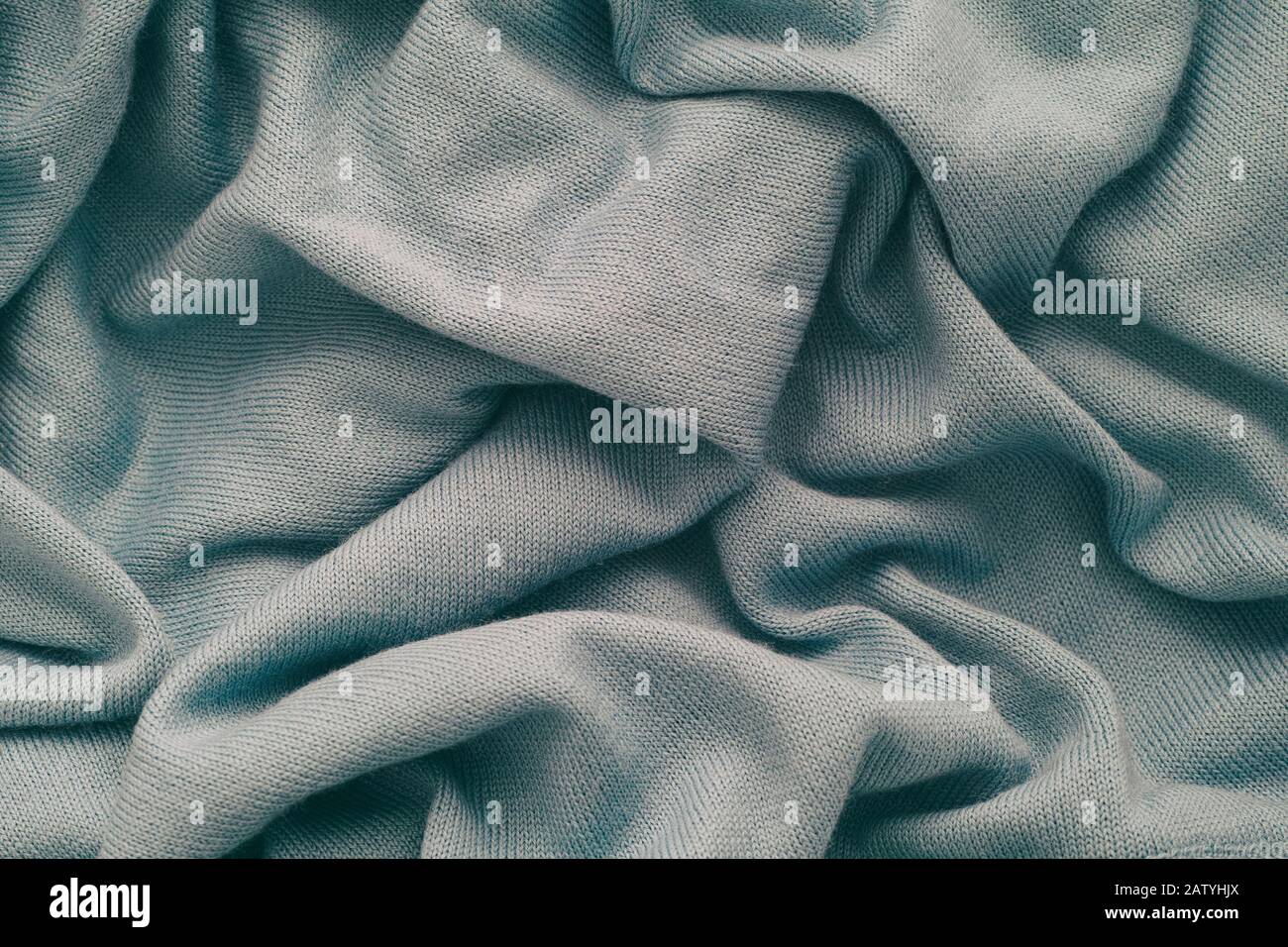 Light gray wrinkled wool texture background. Close up. Stock Photo