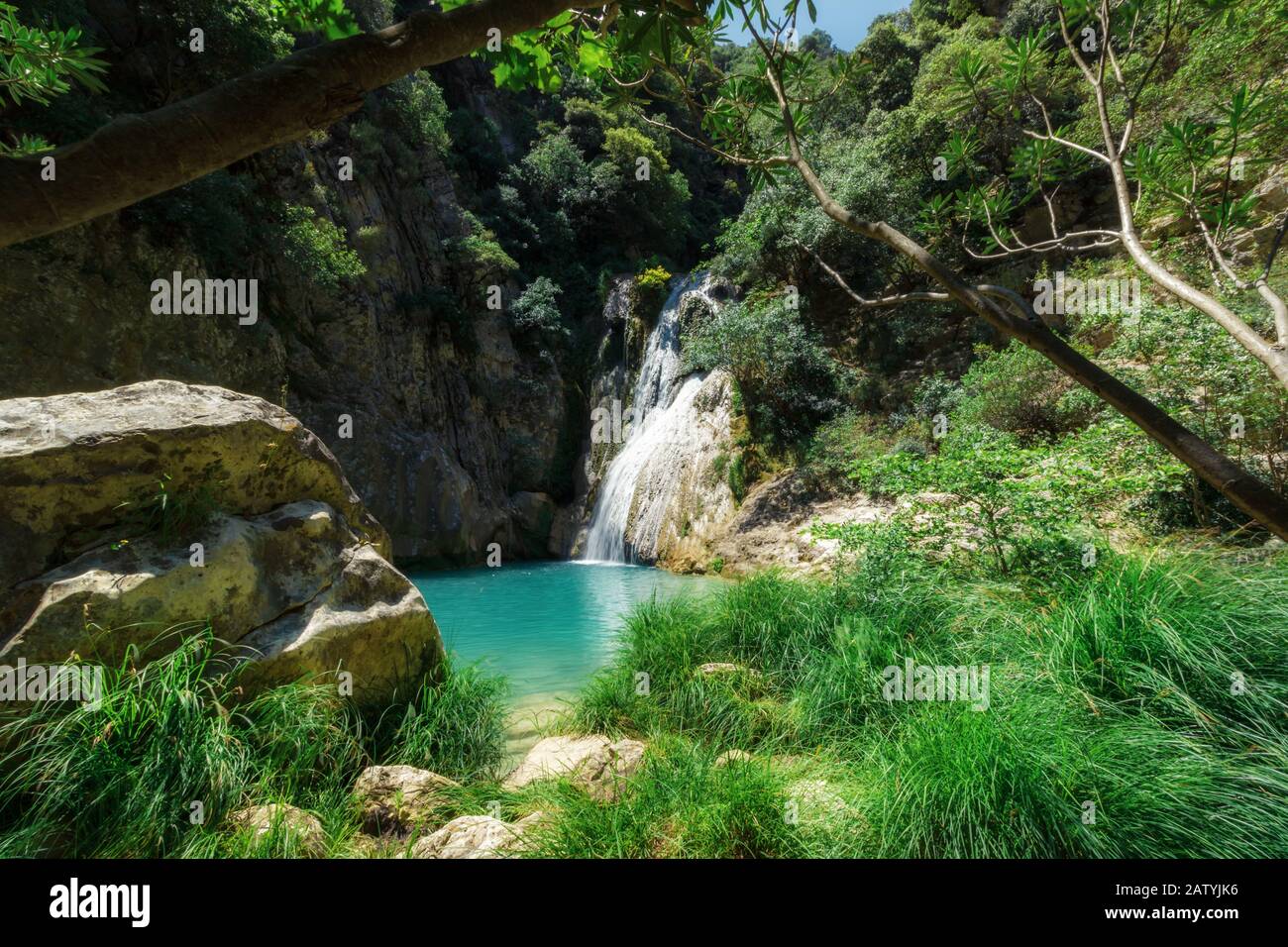 Polylimnio waterfall and its pool in one of the gorges of Peloponnese in Greece Stock Photo