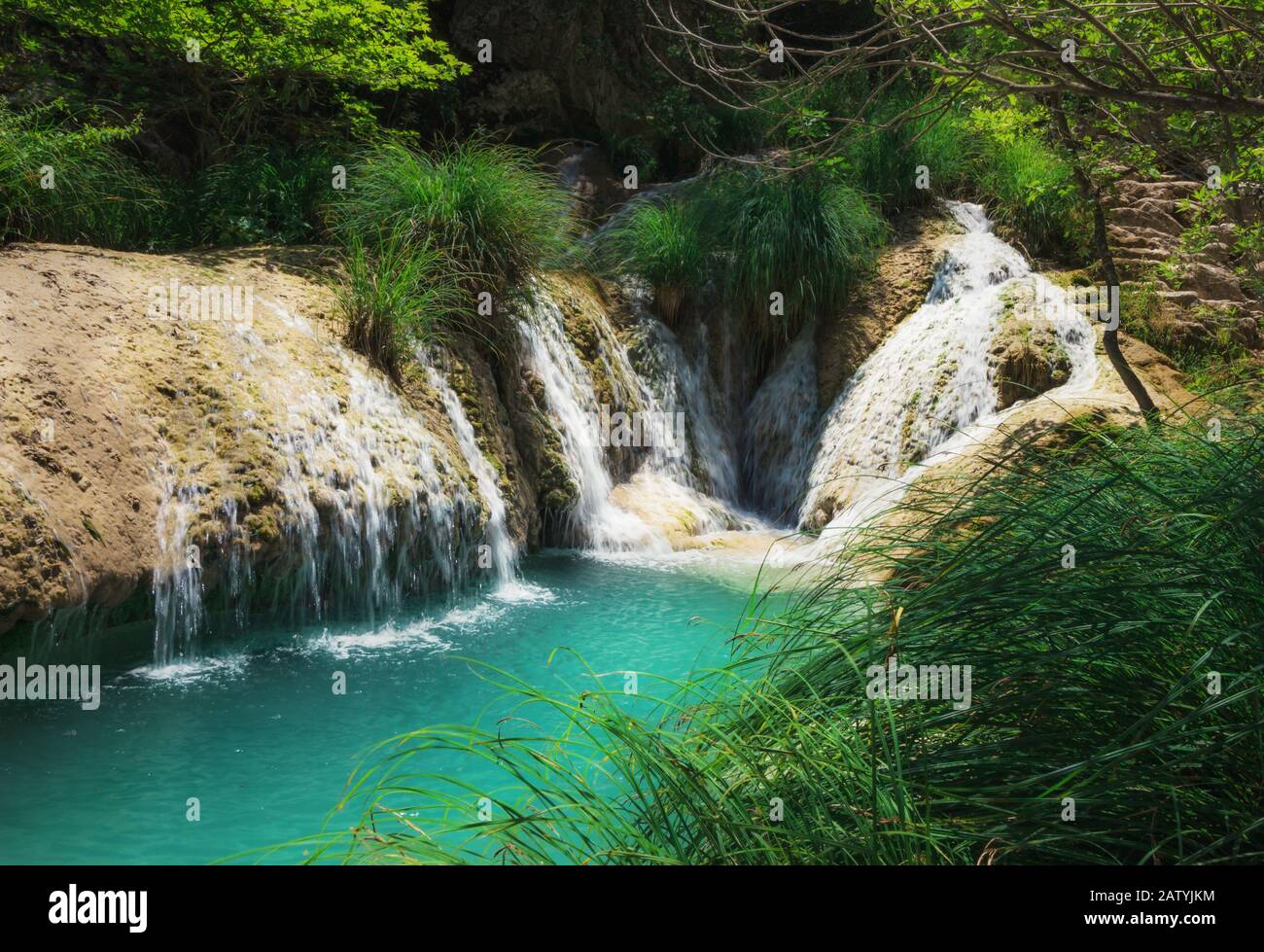 Polylimnio waterfall and its pool in one of the gorges of Peloponnese in Greece Stock Photo