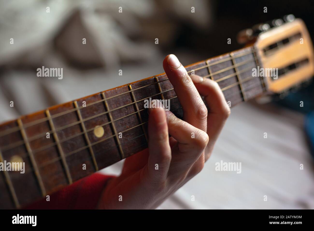 virtuoso guitarist playing his acoustic guitar. Stock Photo