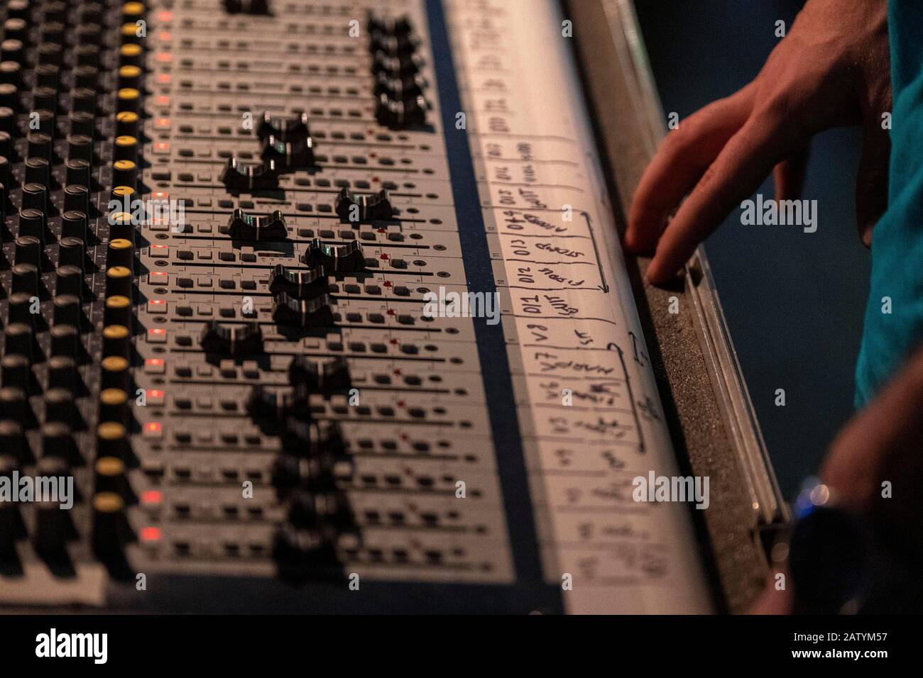 Sound Engineers working at mixing desk Stock Photo Alamy