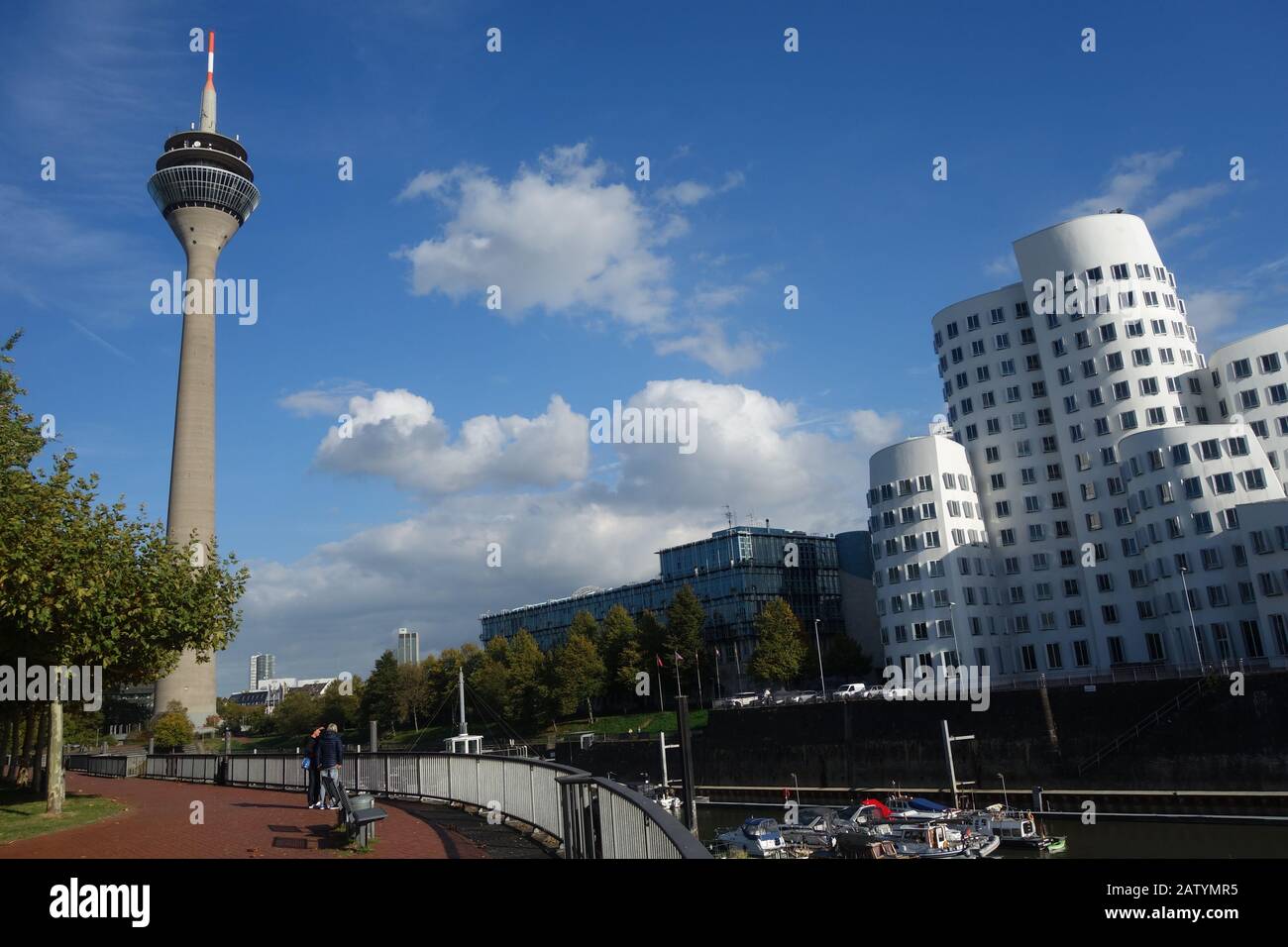 Architecture along the banks of the Media Harbour in Dusseldorf, including the Rhine Tower, WDR-Studio and a Gehry building. Stock Photo