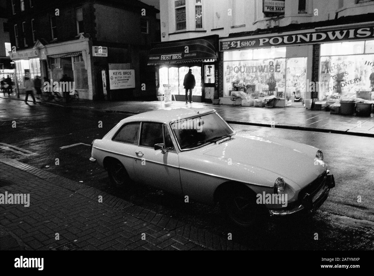 'SO BRITISH' A MGB PARKED AT NIGHT IN WORTHING STREET SUSSEX ENGLAND - STREET CAR PHOTOGRAPHY - SILVER FILM © Frédéric BEAUMONT Stock Photo