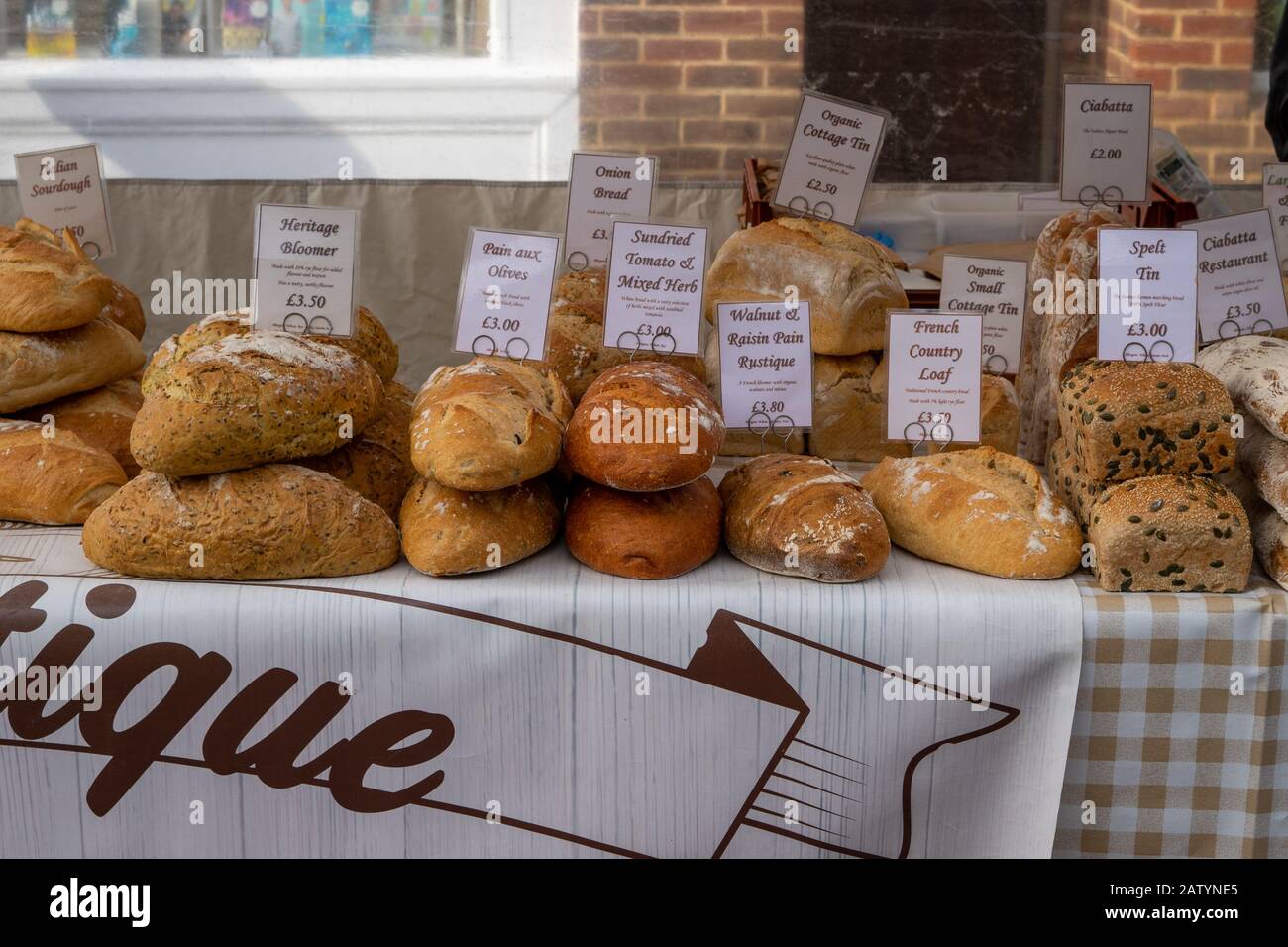 Various organic loaves of bread on a markets stall Stock Photo