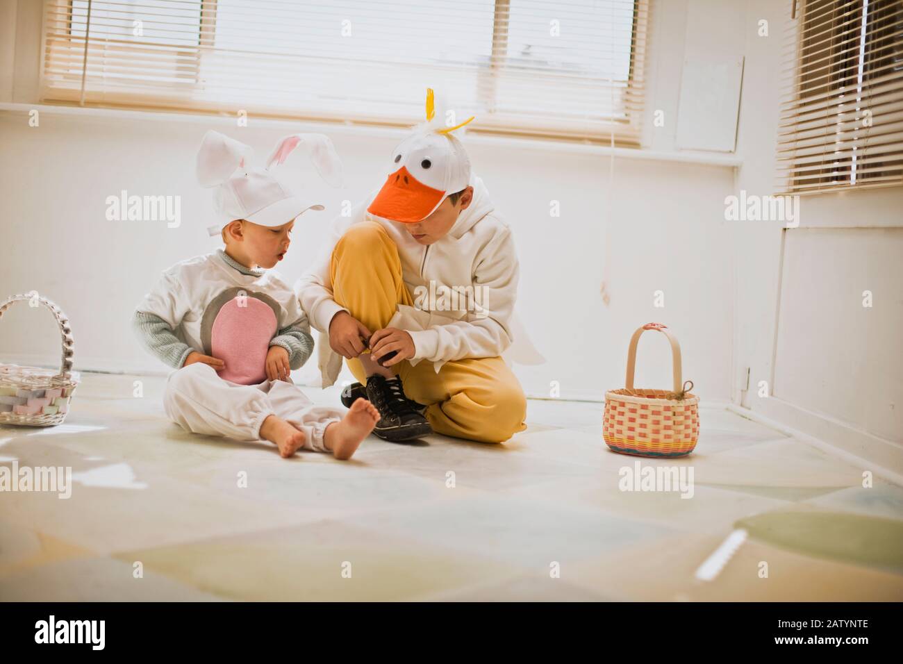 Two brothers dressed up for Easter with their Easter baskets Stock Photo