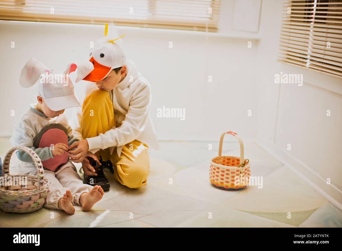 Two brothers dressed up for Easter with their Easter baskets Stock Photo