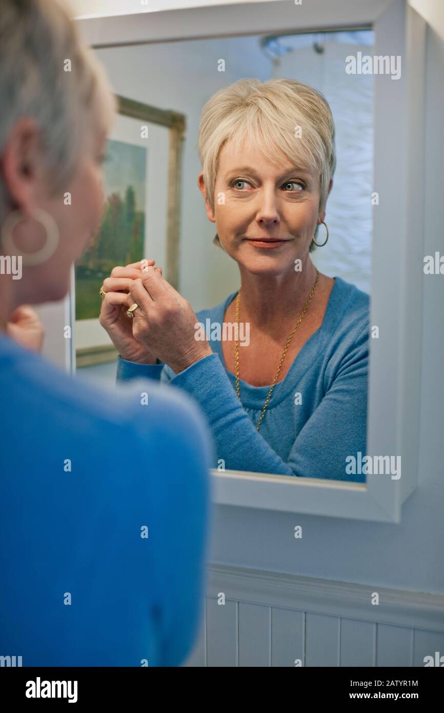 Woman with earrings hi-res stock photography and images - Alamy