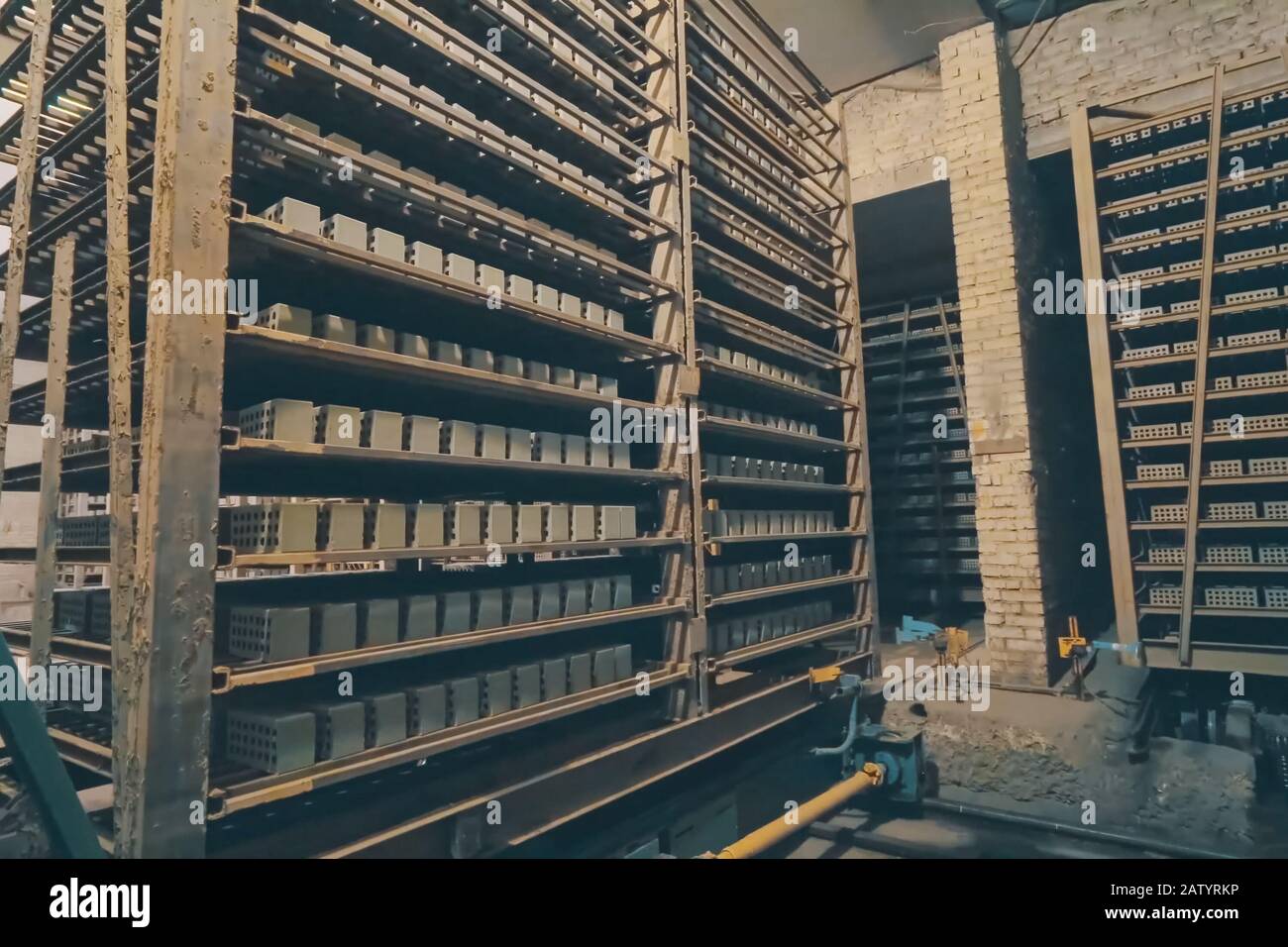 The brick is raw. Move raw bricks to the kiln. Brick production, hollow