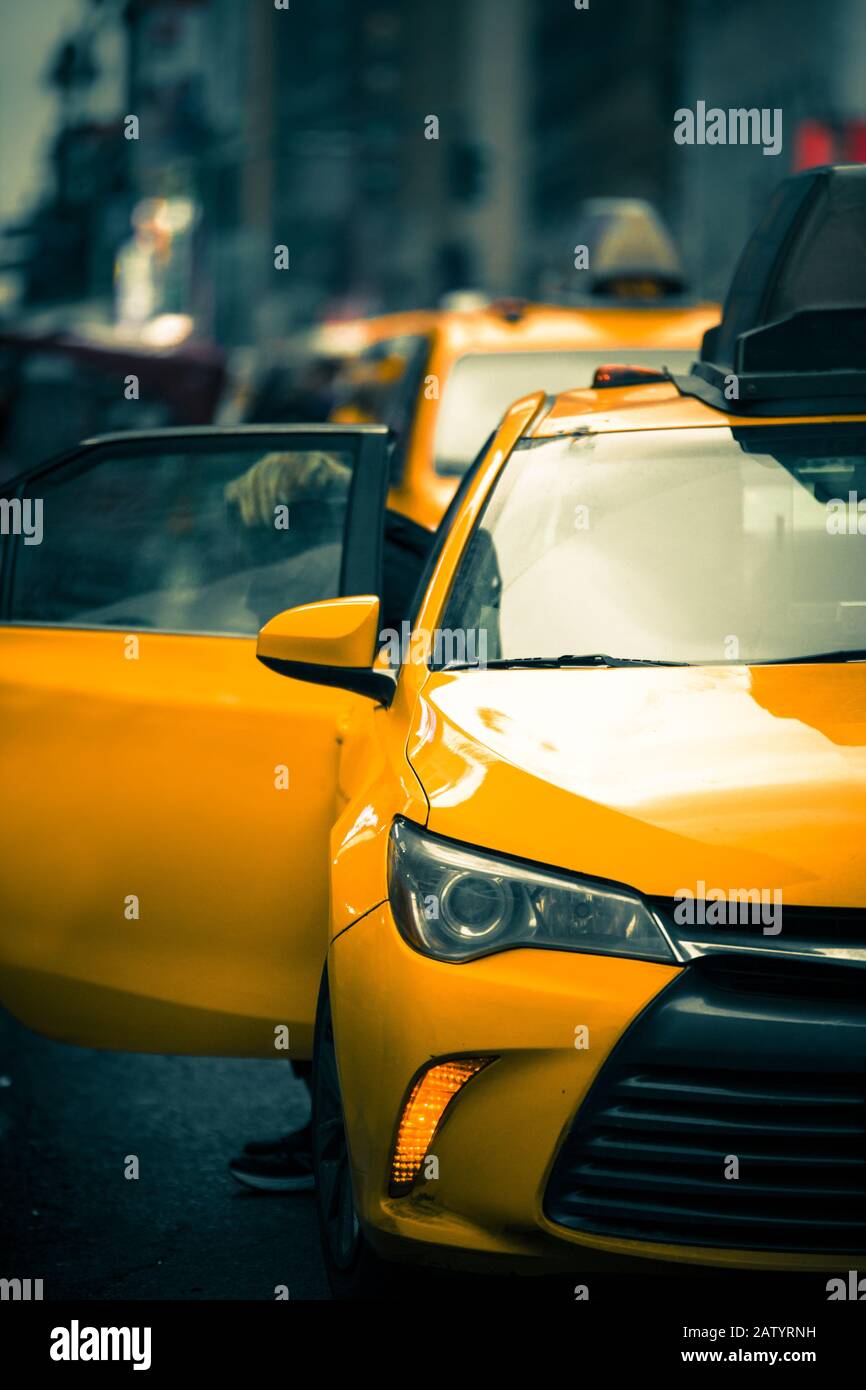 New York City Street scene with iconic yellow taxi cab Stock Photo