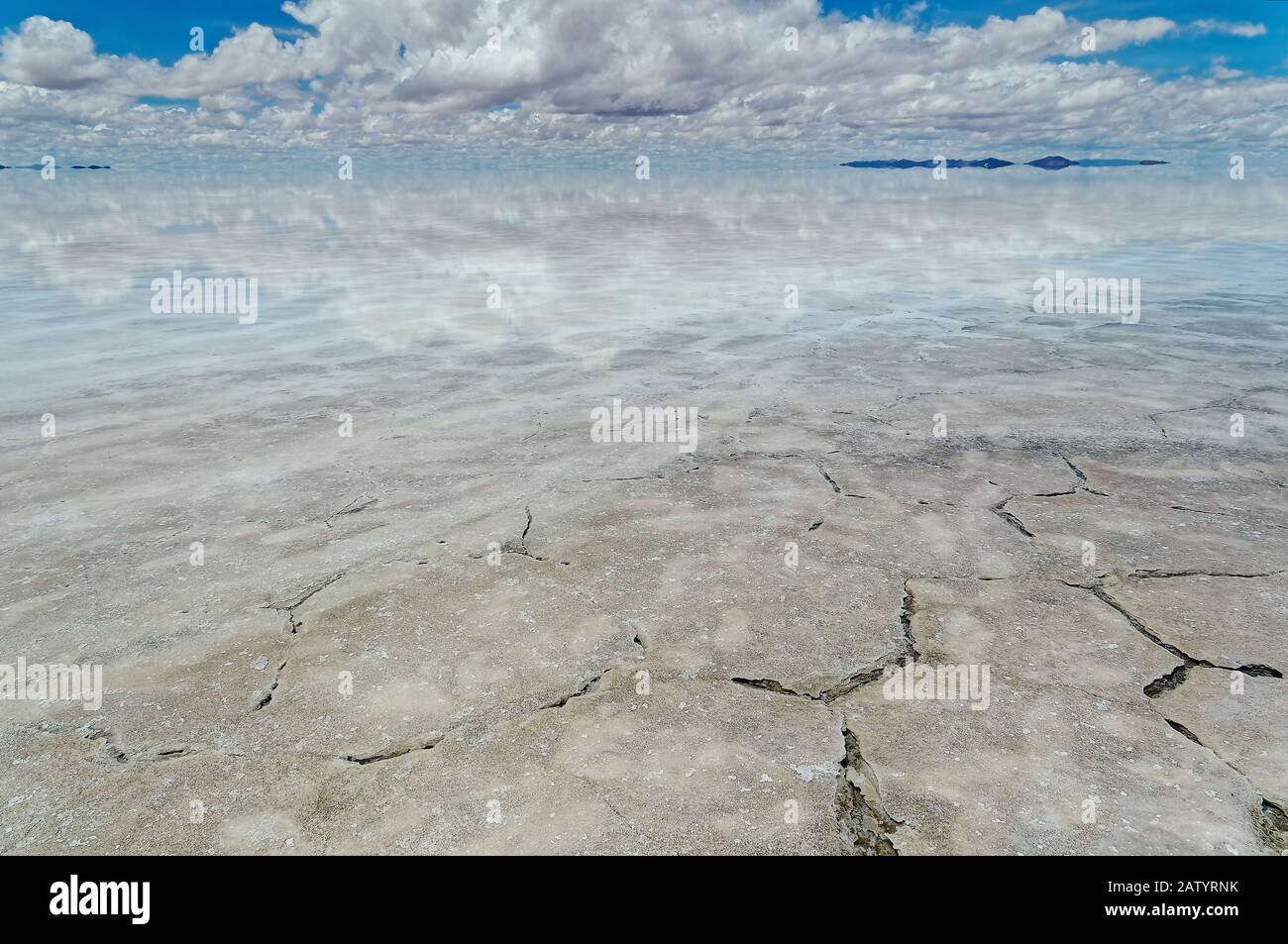An exploration day over Uyuni salt flat, can show amazing sky's reflections over flooded salt flat, such beautiful images extends on endless horizon. Stock Photo
