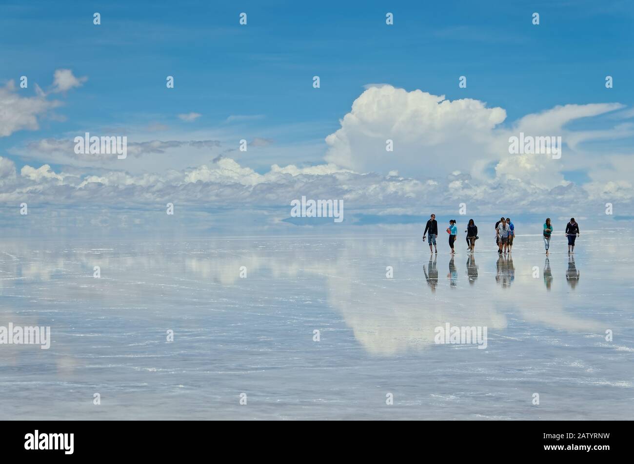 An exploration day over Uyuni salt flat, shows amazing sky's reflections over flooded salt flat, such beautiful images extends on endless horizon. Stock Photo