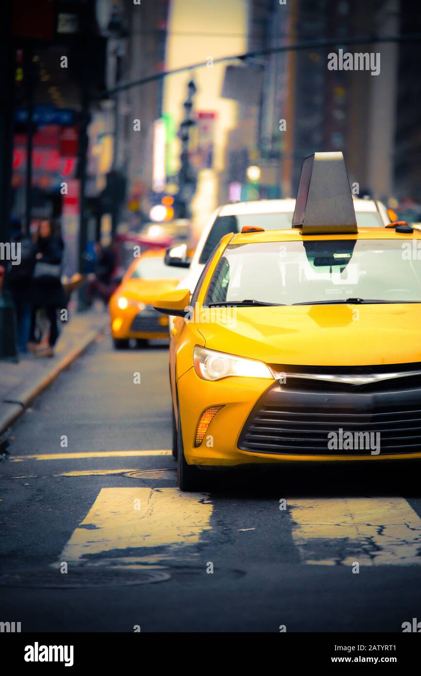 New York City Street scene with iconic yellow taxi cab Stock Photo