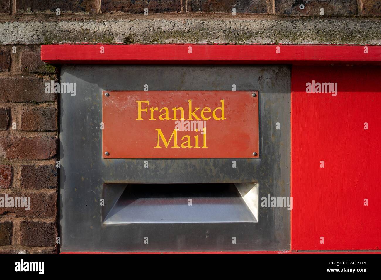 A red postbox with the words franked mail above it Stock Photo