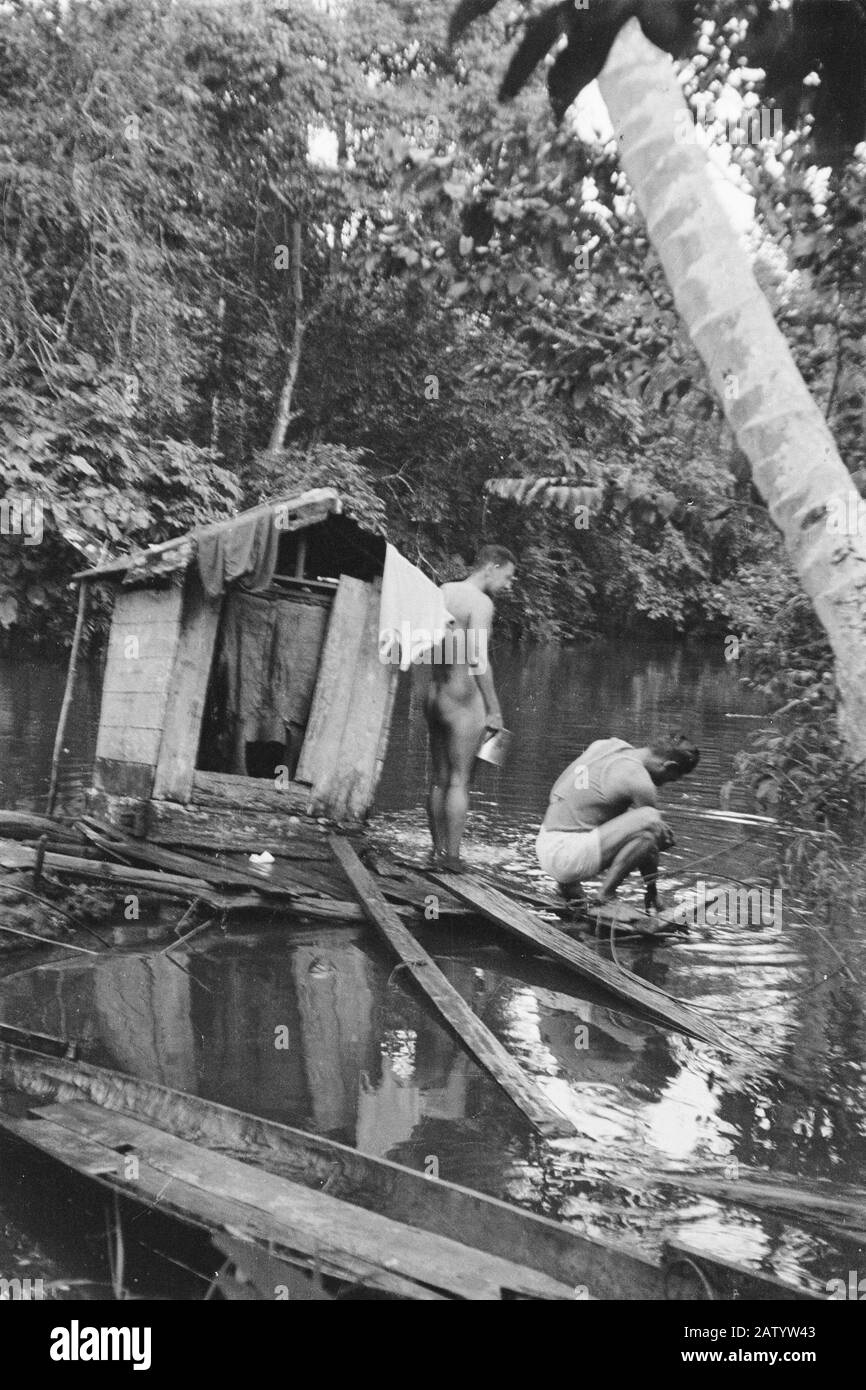Borneo  Soldiers bathe at the river Date: February 1947 Location: Borneo, Indonesia, Kalimantan, Dutch East Indies Stock Photo