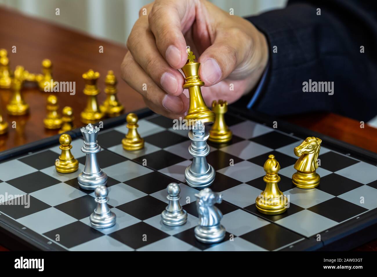 Chess game on chess board behind business man background. Business concept  to present financial information and marketing strategy analysis. Investmen  Stock Photo - Alamy