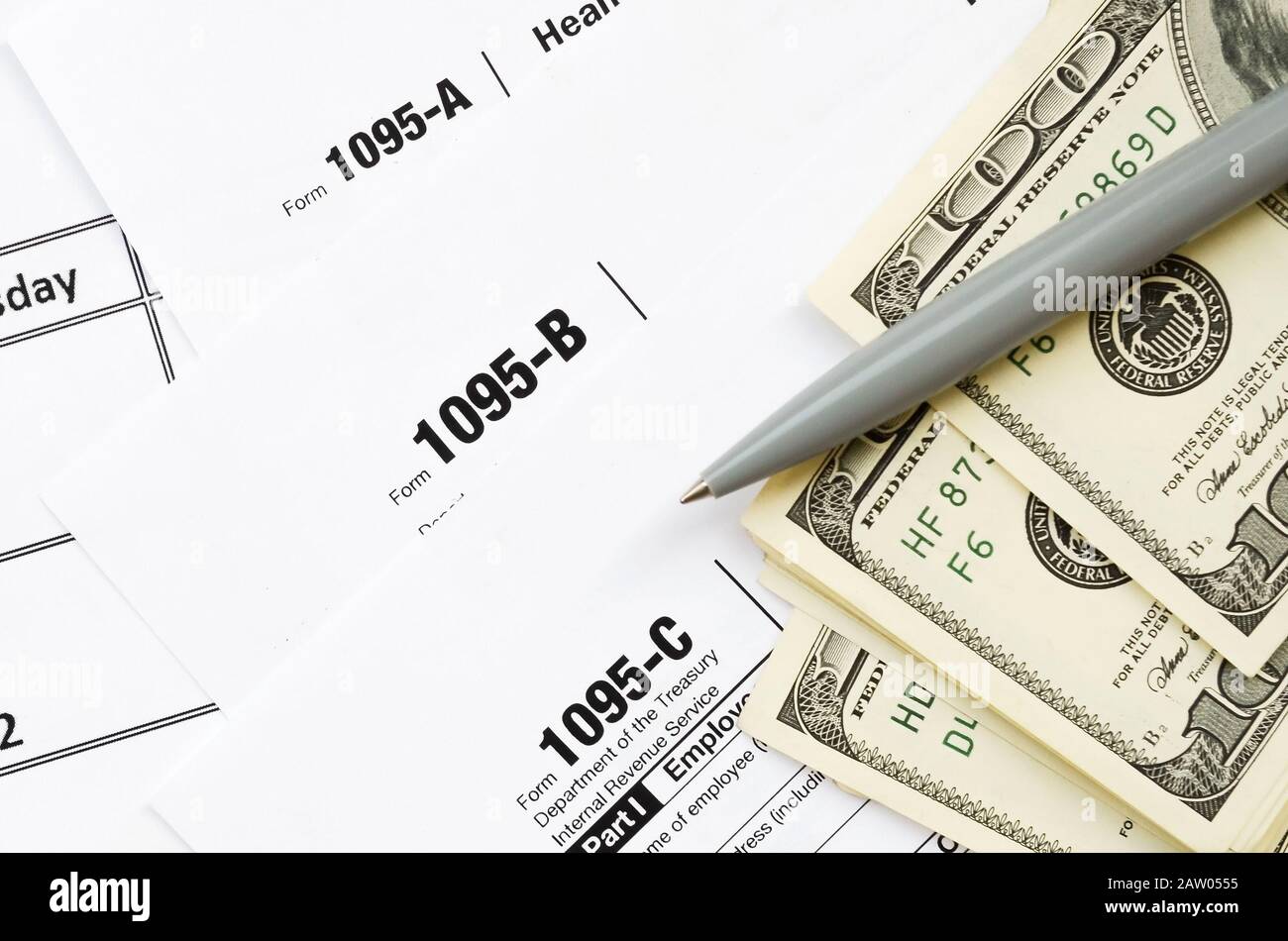 Irs Form 1095 A 1095 B And 1095 C Blank Lies On Empty Calendar Page With Pen And Dollar Bills Tax Period Concept Copy Space For Text Stock Photo Alamy