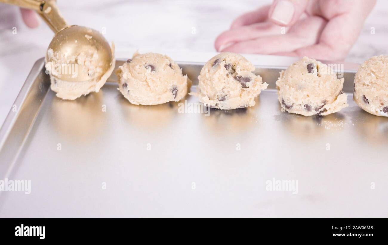 Step by step. Scooping homemade chocolate chip cookies with metal dough