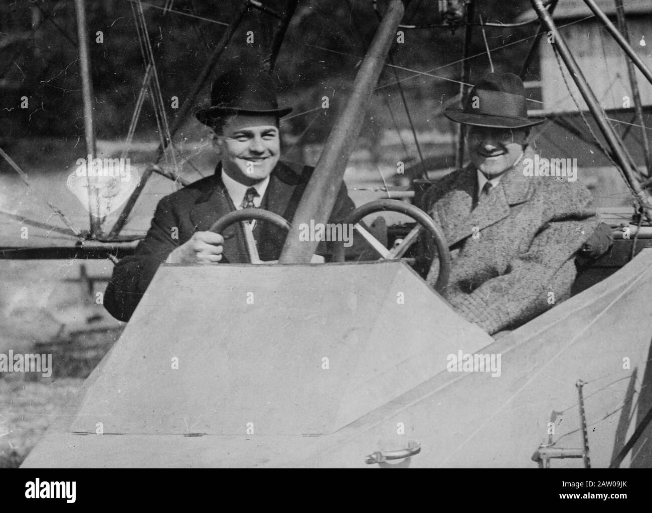 F.J. Bersbach and Harold F. McCormick (1872-1941) seated in a Curtiss Hydro-Aeroplane (flying boat) owned by Logan 'Jack' Vilas (1891-1976). Stock Photo