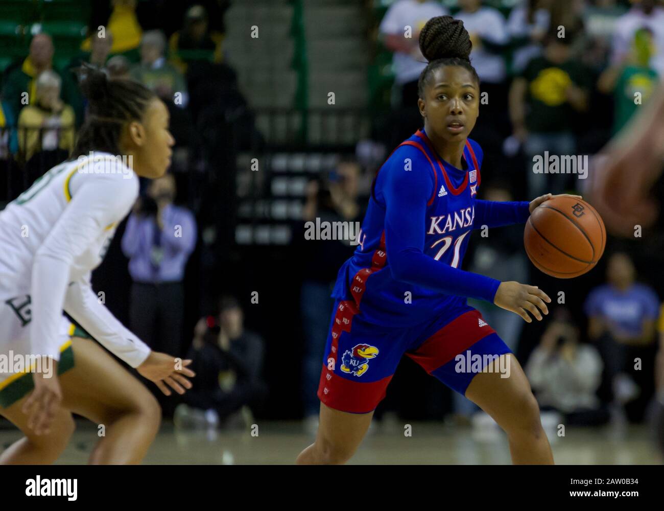 Waco, Texas, USA. 5th Feb, 2020. Kansas Jayhawks guard Chandler Prater (25) dribbles the ball against Baylor Lady Bears guard Juicy Landrum (20) during the 1st half of the NCAA Women's Basketball game between Kansas Jayhawks and the Baylor Lady Bears at The Ferrell Center in Waco, Texas. Matthew Lynch/CSM/Alamy Live News Stock Photo