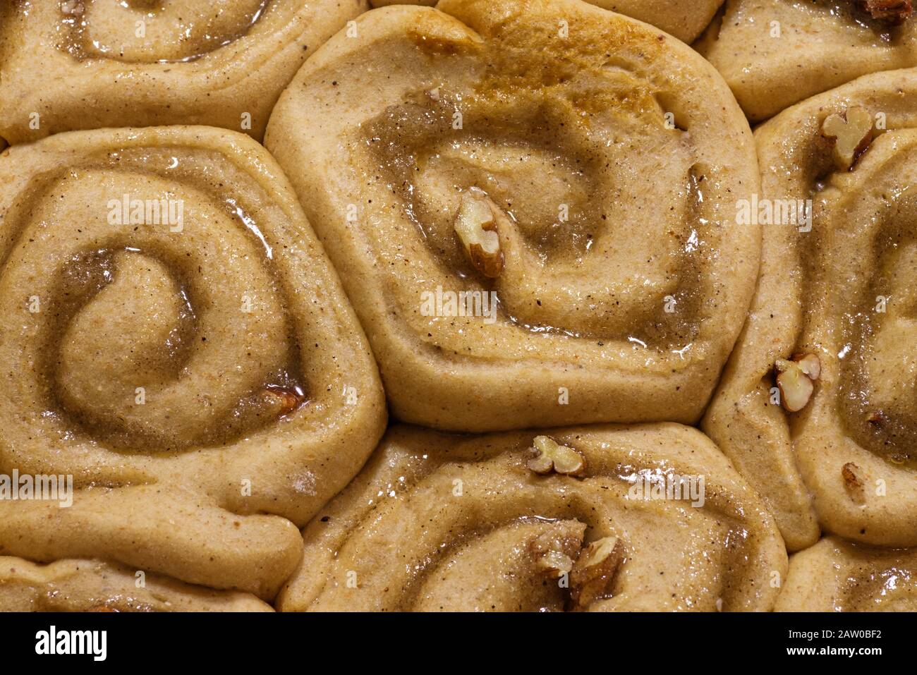 detail of raw unbaked sticky bun rolls after rising Stock Photo