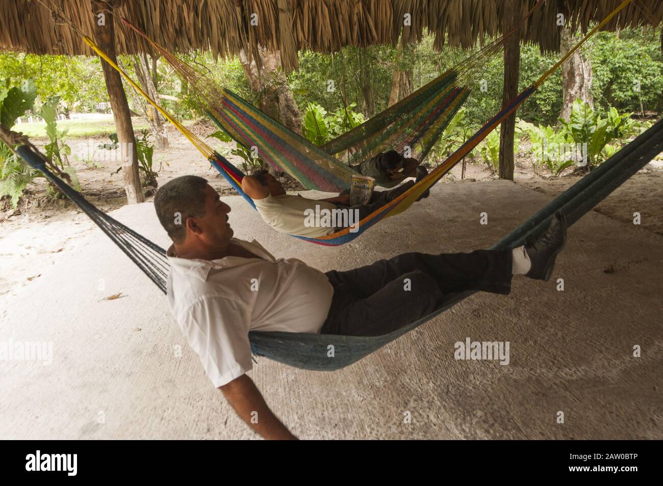 Guatemala, Tikal National Park, rainforest lodge, people relaxing in