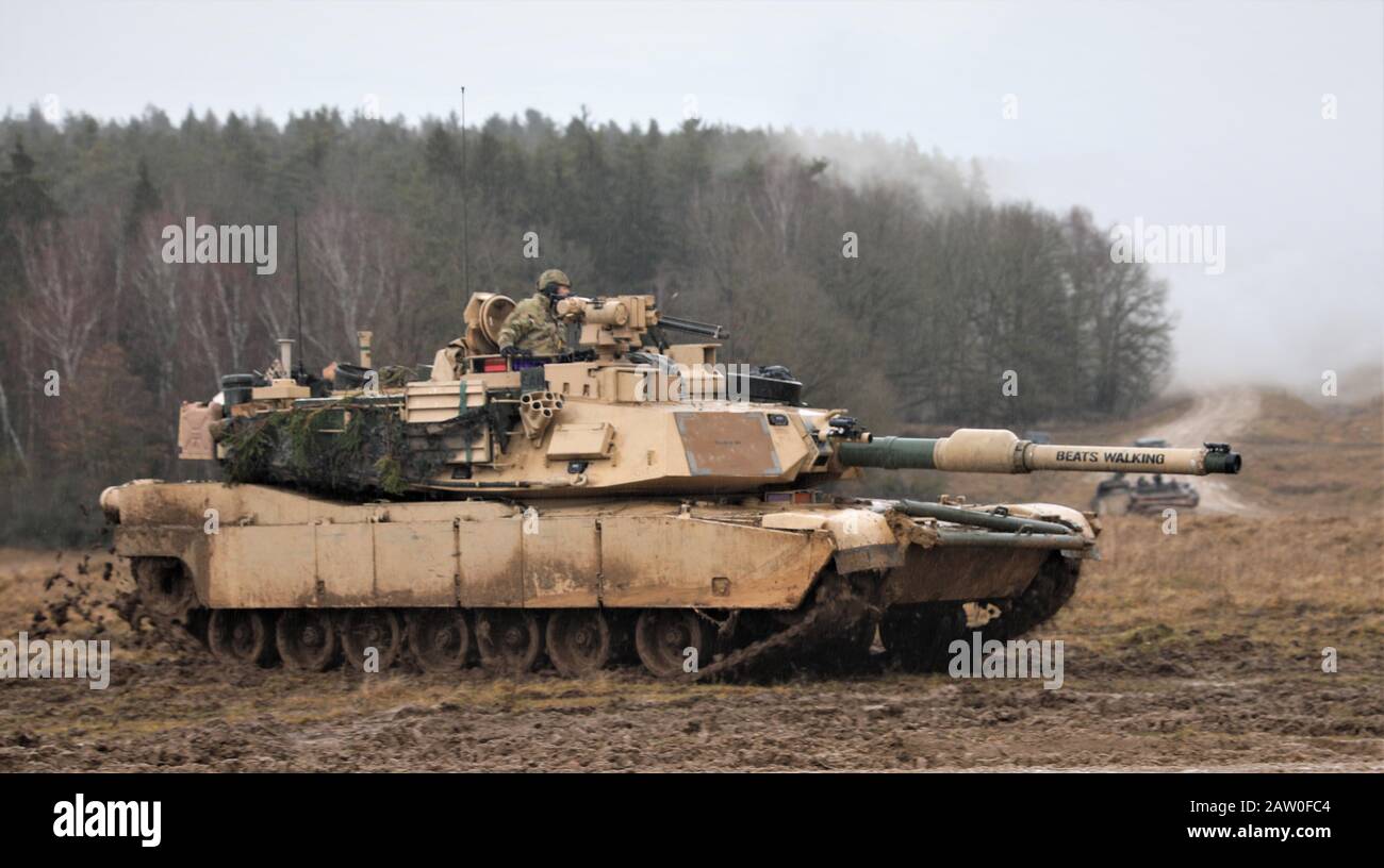1st Battalion, 8th Cavalry Regiment, 2nd Armored Brigade Combat Team, 1st Cavalry Division, M1A2 Abrams tank secures fighting position during training exercise Combined Resolve XIII at the Joint Multinational Readiness Center in Hohenfels, Germany on Feb. 2, 2020. Combined Resolve XIII is a Headquarters Department of the Army directed Multinational Unified Land Operation exercise with the U.S. Regionally Aligned Force Brigade in support of European Command (EUCOM) objectives. The purpose of the exercise is to prepare 2nd Armored Brigade Combat Team, 1st Calvary Division along with 16 other all Stock Photo