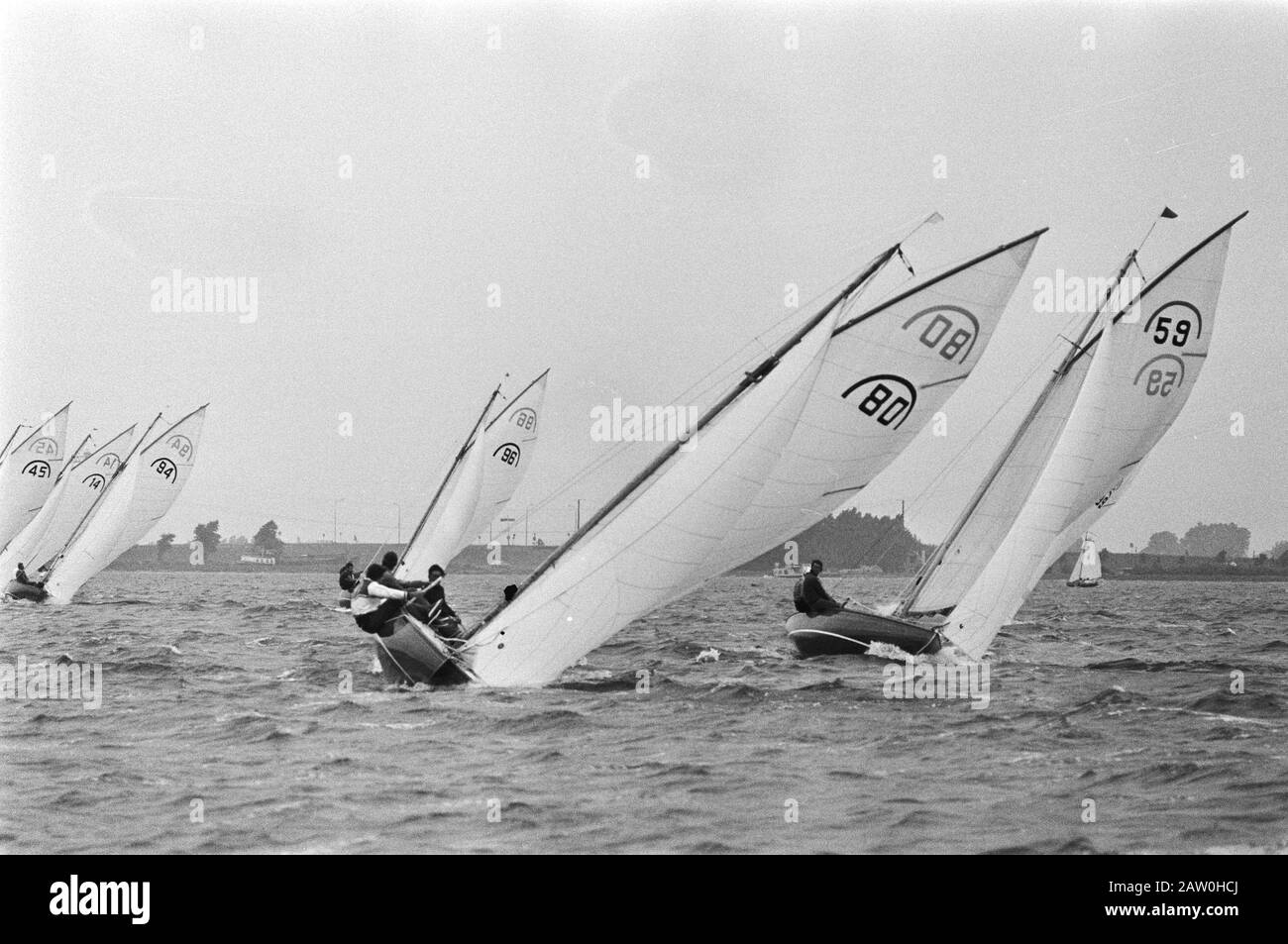 Dutch Championship Sailing, Rainbow Class on Alkmaardermeer, number 59, John Mason Date: July 10, 1976 Location: Alkmaardermeer Keywords: CHAMPIONSHIPS, SAILING Stock Photo