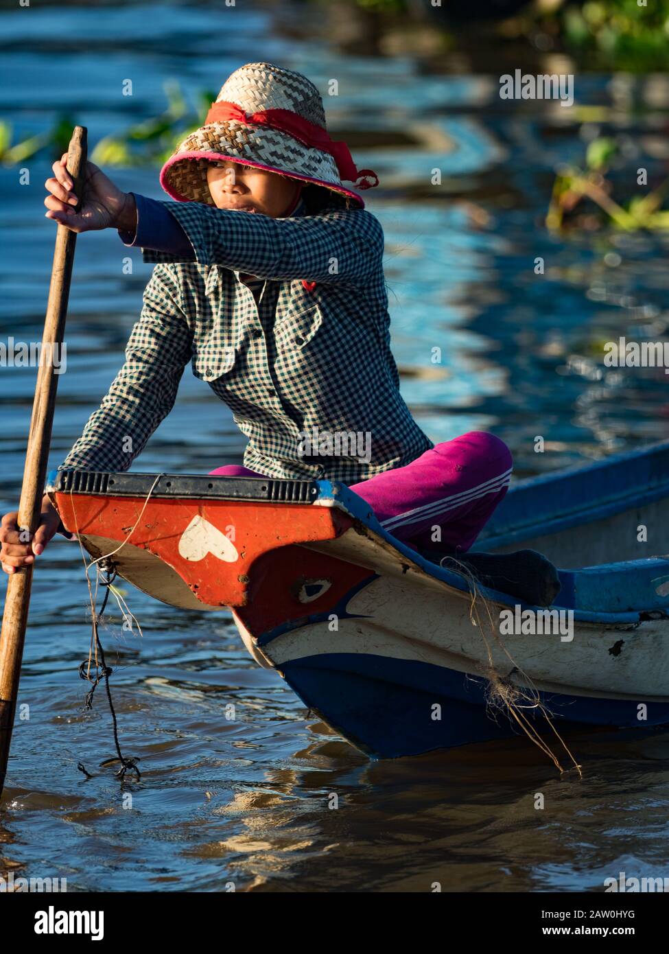 The people of Prek Toal on the Tonle Sap lake live in a floating village spending much of their life on the water in everything they do Stock Photo