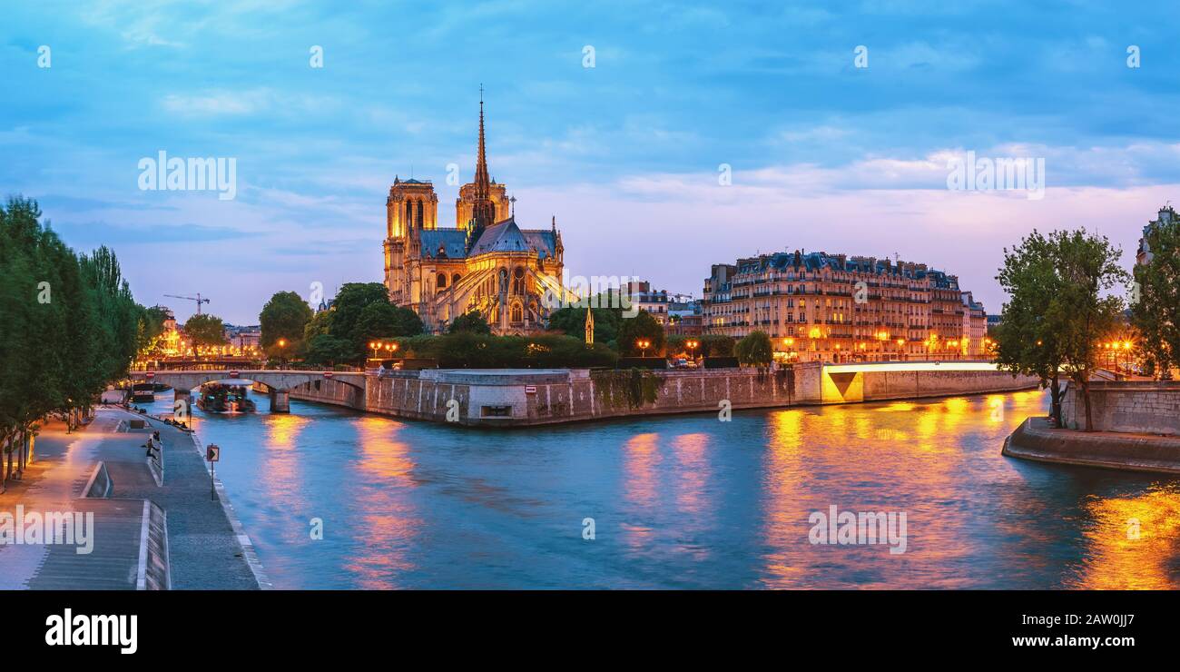 Paris France, panorama city skyline night at Notre Dame de Paris Cathedral and Seine River Stock Photo
