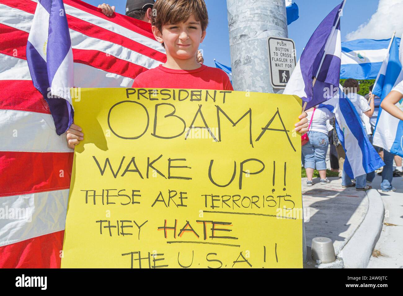 Miami Florida,protest,Hispanic protesting street named after corrupt Nicaraguan general,flag,protesters,student students boy boys male kids children F Stock Photo