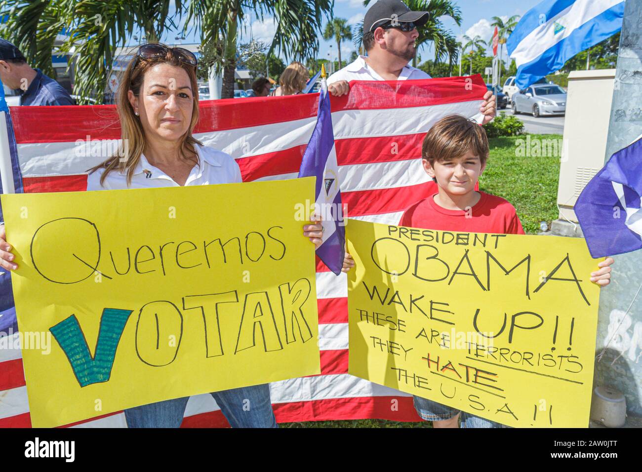 Miami Florida,protest,Hispanic protesting street named after corrupt Nicaraguan general,flag,protesters,student students mother,parent,parents,boy boy Stock Photo