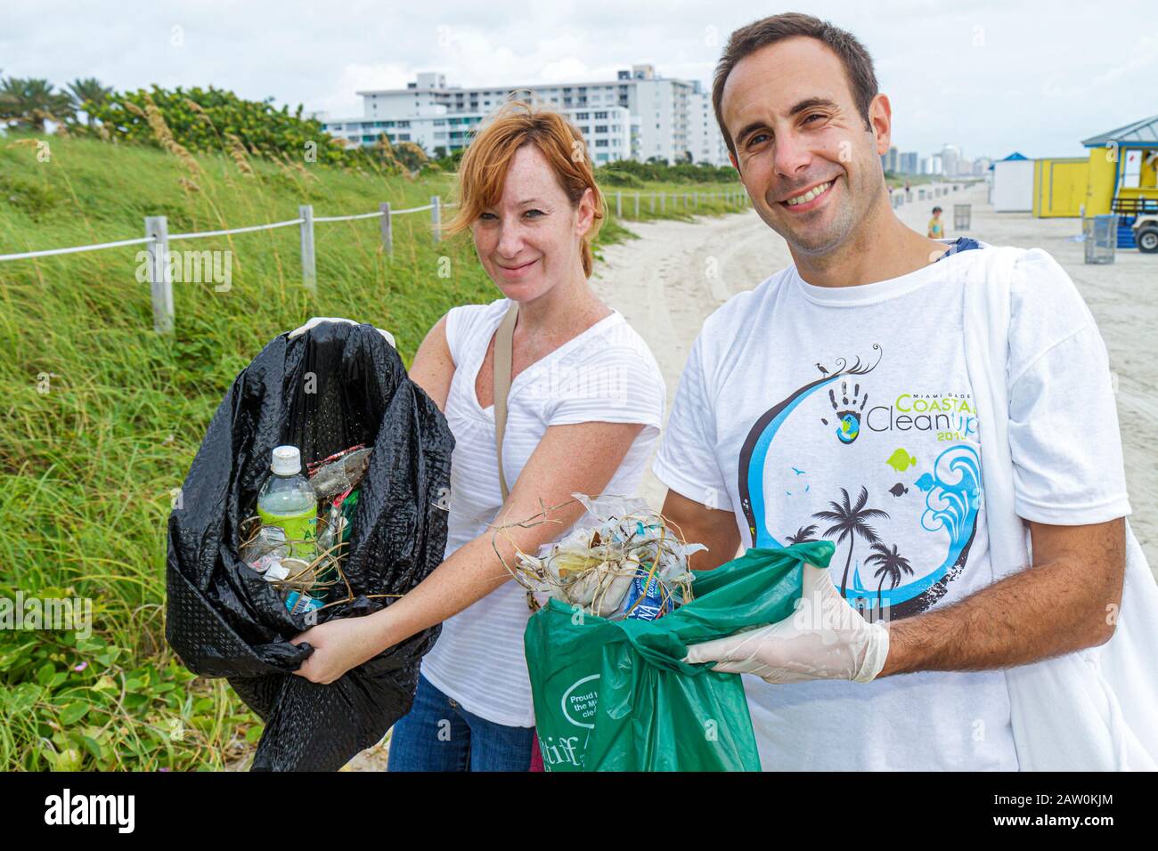 Miami Beach Florida,Coastal Cleanup Day,volunteer volunteers volunteering work worker workers,teamwork working together serving help lending,helping l Stock Photo