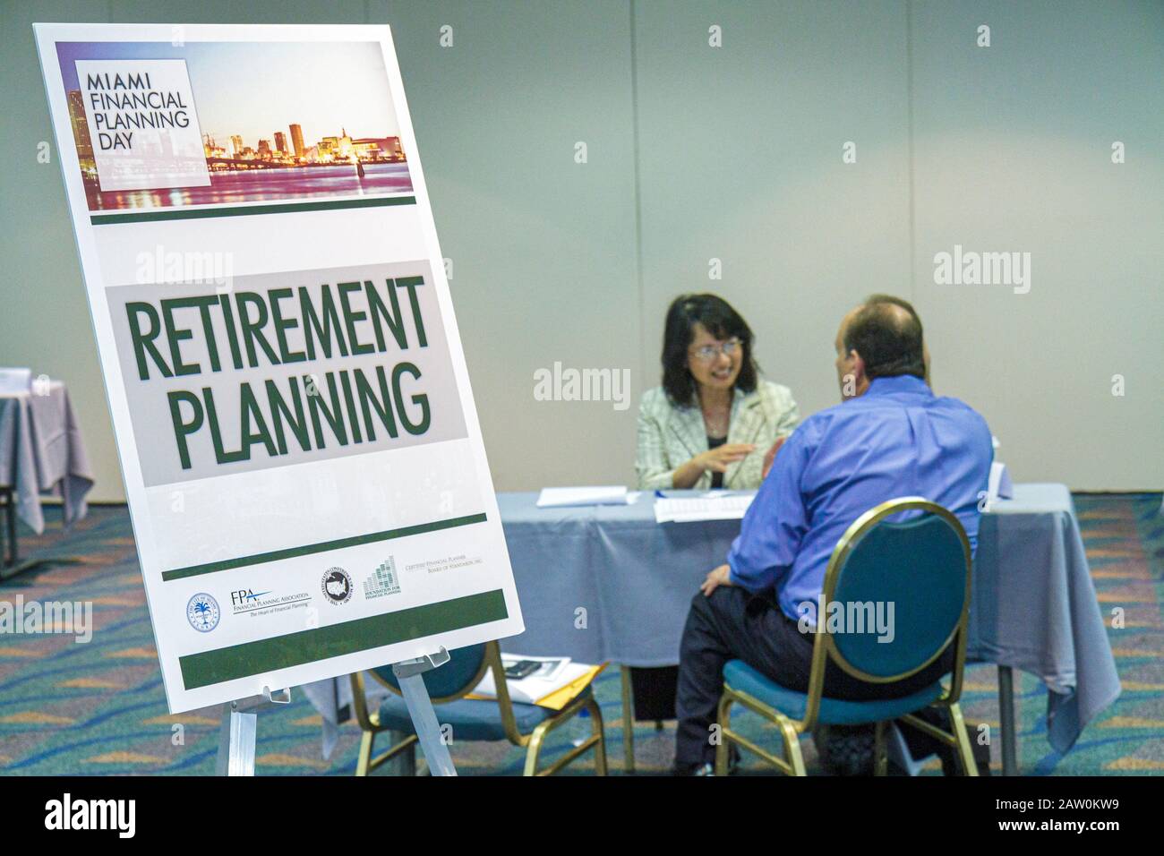 Miami Florida,James L. Knight Convention Center,Miami Financial Planning Day,free advice,guidanceal planners,sign,retirement planning,Asian woman fema Stock Photo