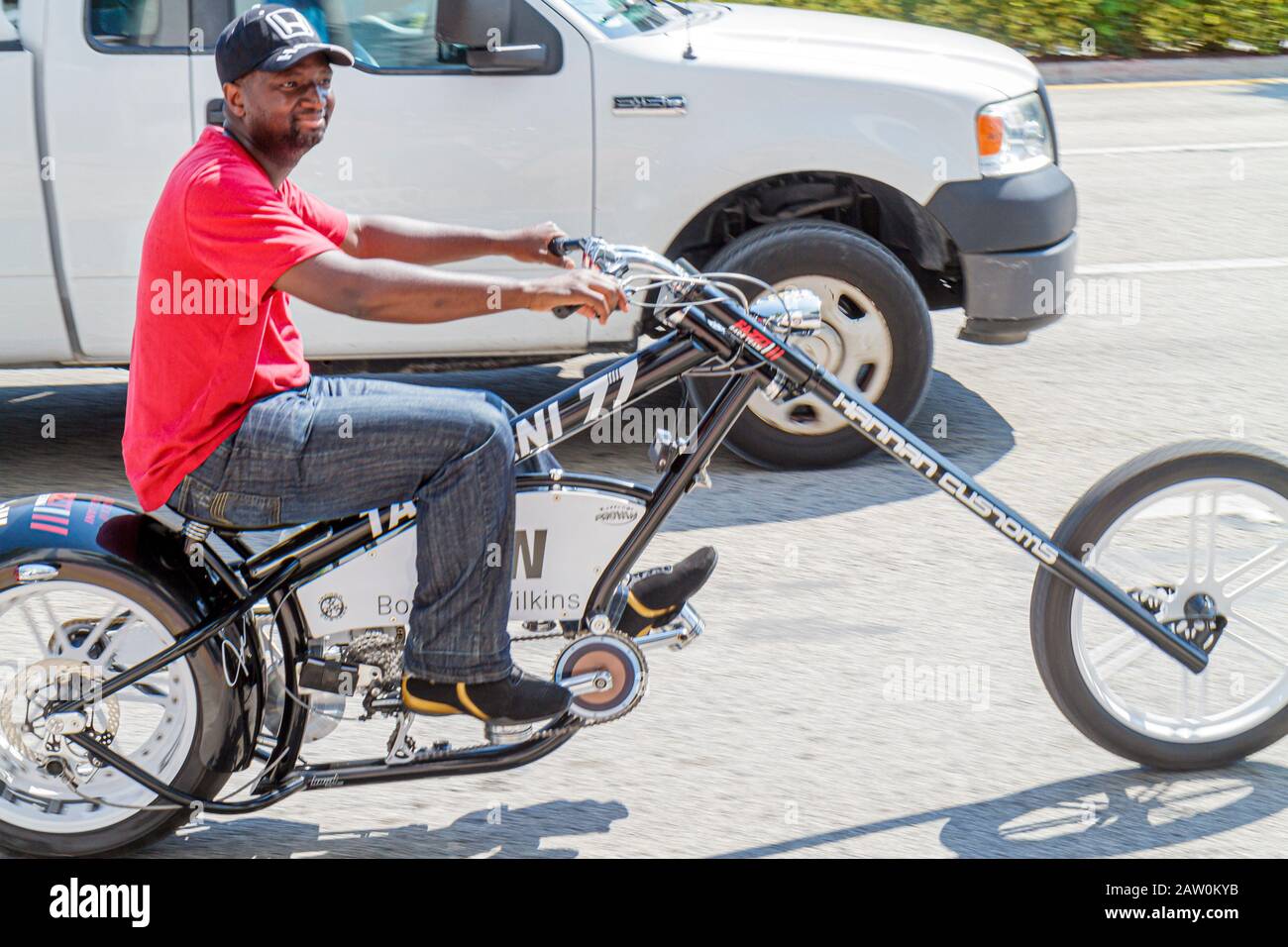 Miami Beach Florida,5th Fifth Street,customized bicycle,bicycling,riding,biking,rider,imitation motorcycle,chopper,pedal,Black man men male,FL10100206 Stock Photo