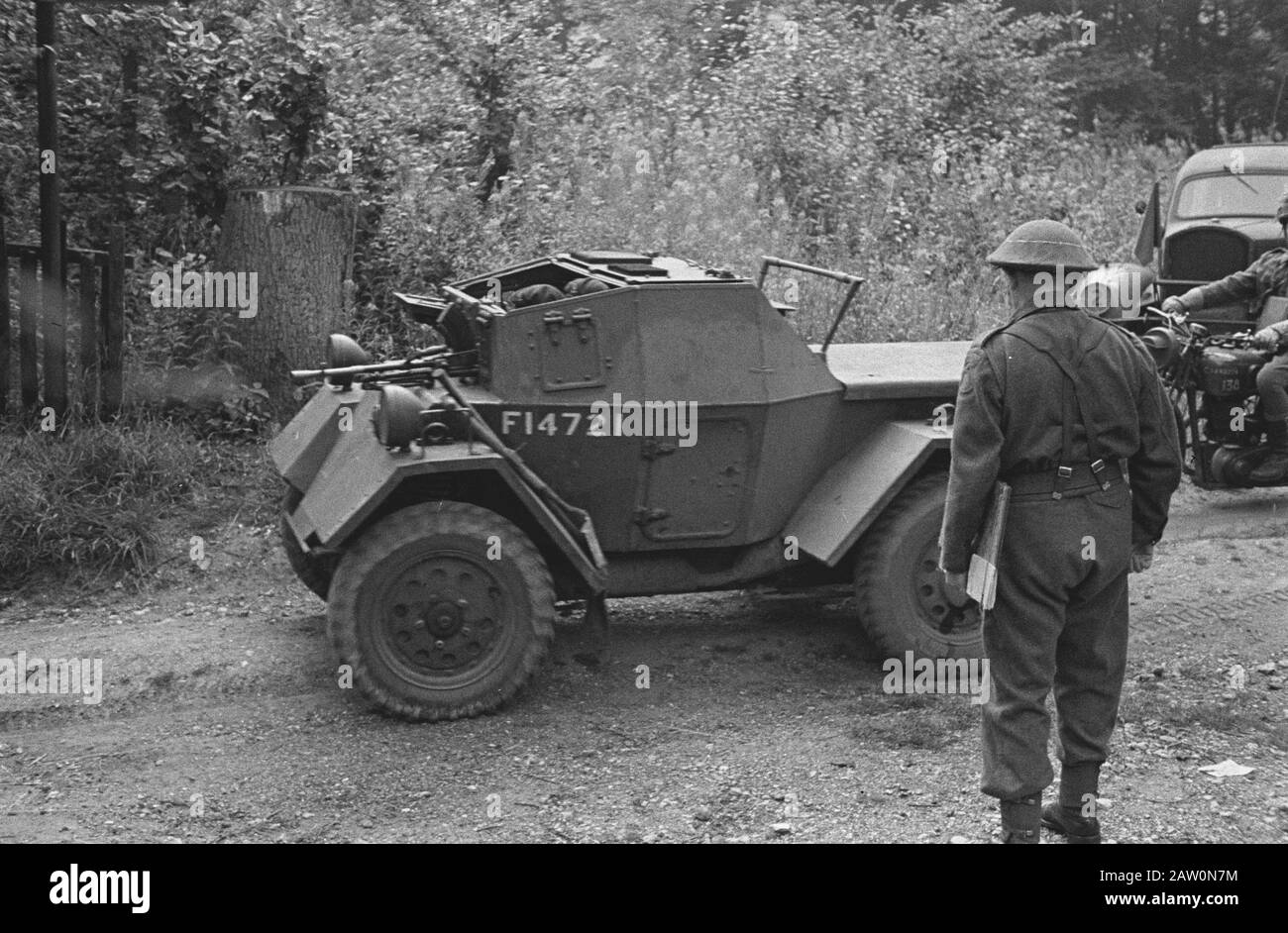 Netherlands Brigade maneuvers. A scoutcar ready to move on [Exercises Princess Irene Brigade. An exploration vehicle ready to go] Annotation: Daimler Scout Car (Dingo) Date: August 1943 Location: United Kingdom Keywords: army maneuvers, soldiers, World War II Stock Photo